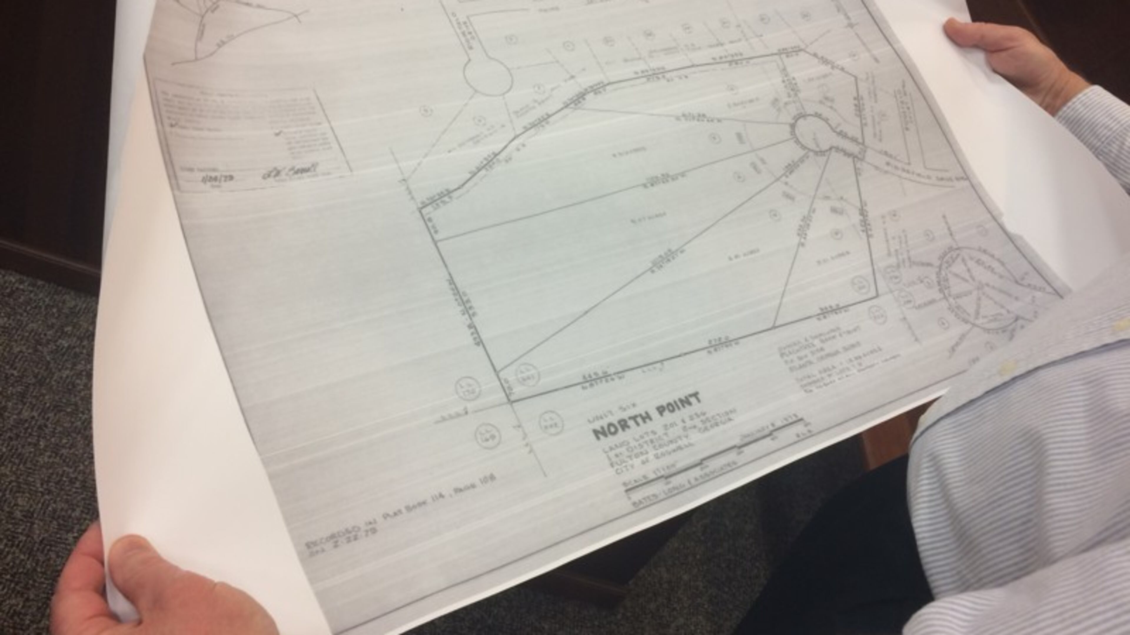 Mike Hartley, North Point resident, pointed to property plans from 1979 at a Roswell Planning Commission meeting in February. He opposes a proposed development in the neighborhood.
