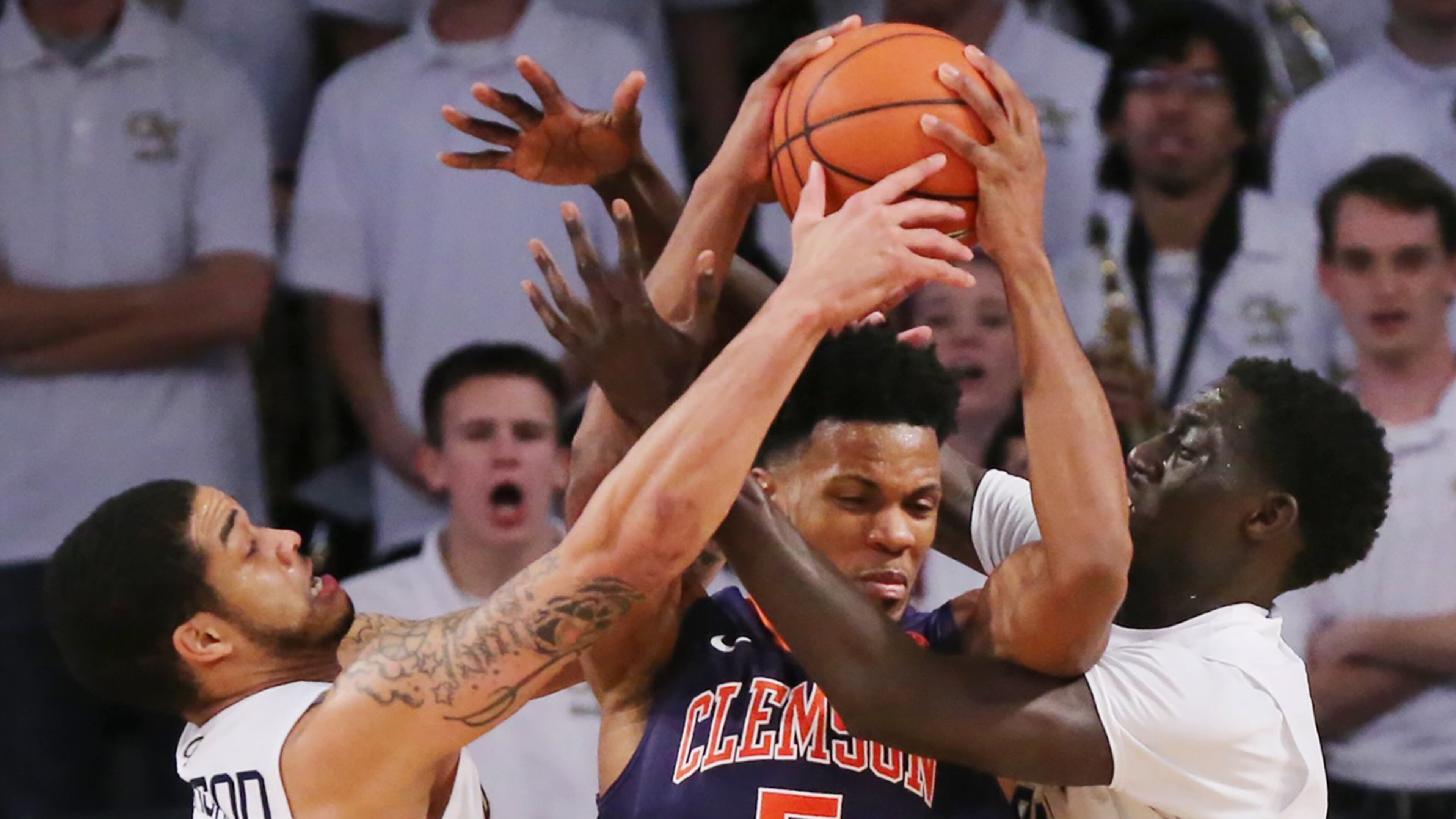 January 12, 2017, Atlanta: Georgia Tech defenders Josh Heath (left) and Abdoulaye Gueye force a turnover on a double team against Clemson forward Jaron Blossomgame during an NCAA basketball game on Thursday, Jan. 12, 2017, in Atlanta. Curtis Compton/ccompton@ajc.com