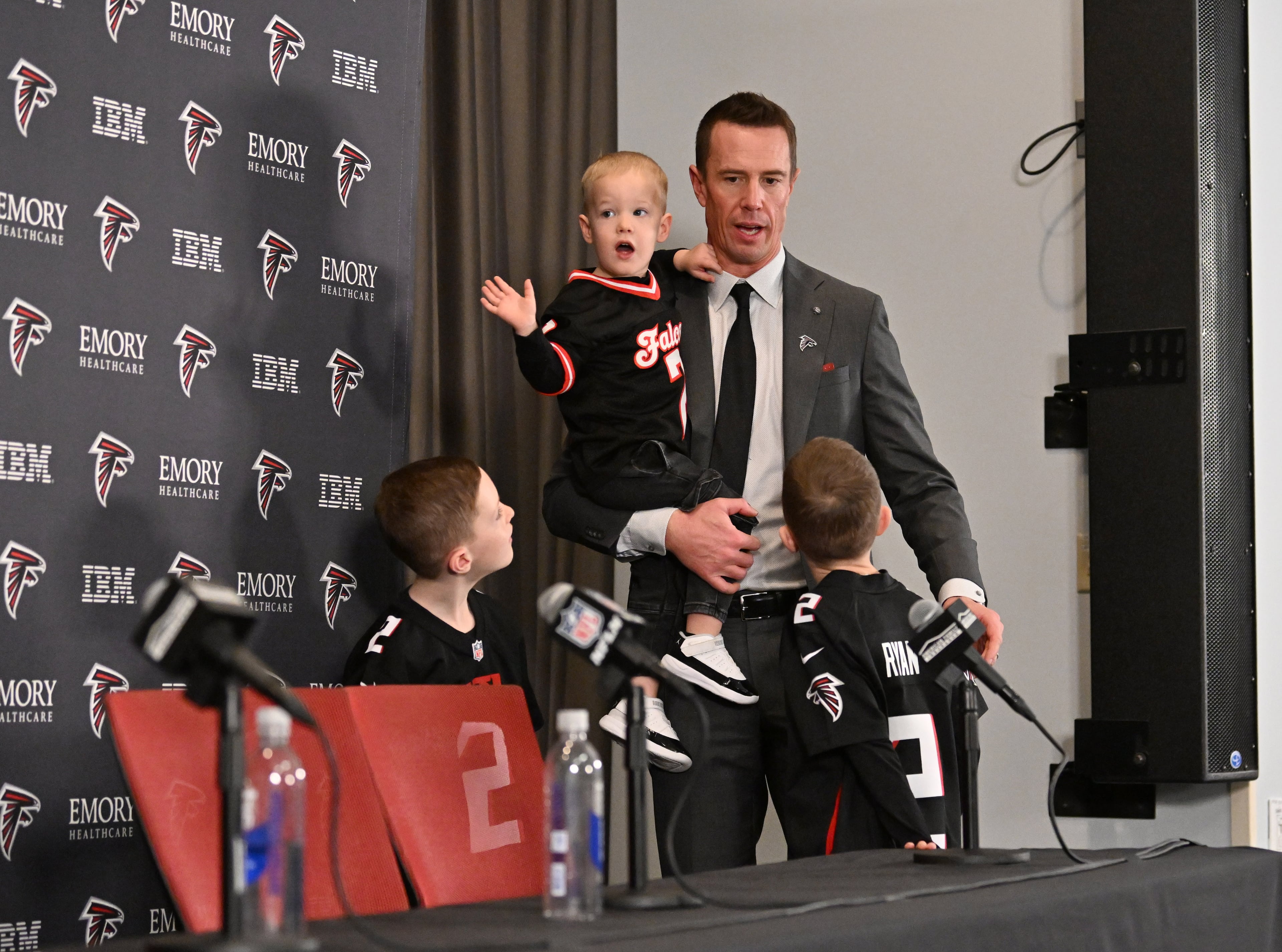 New Atlanta Falcons president of football Matt Ryan with his sons leaves after a news conference to introduce new Falcons president of football Matt Ryan, Tuesday, Jan. 13, 2026, in Flowery Branch. (Hyosub Shin/AJC)