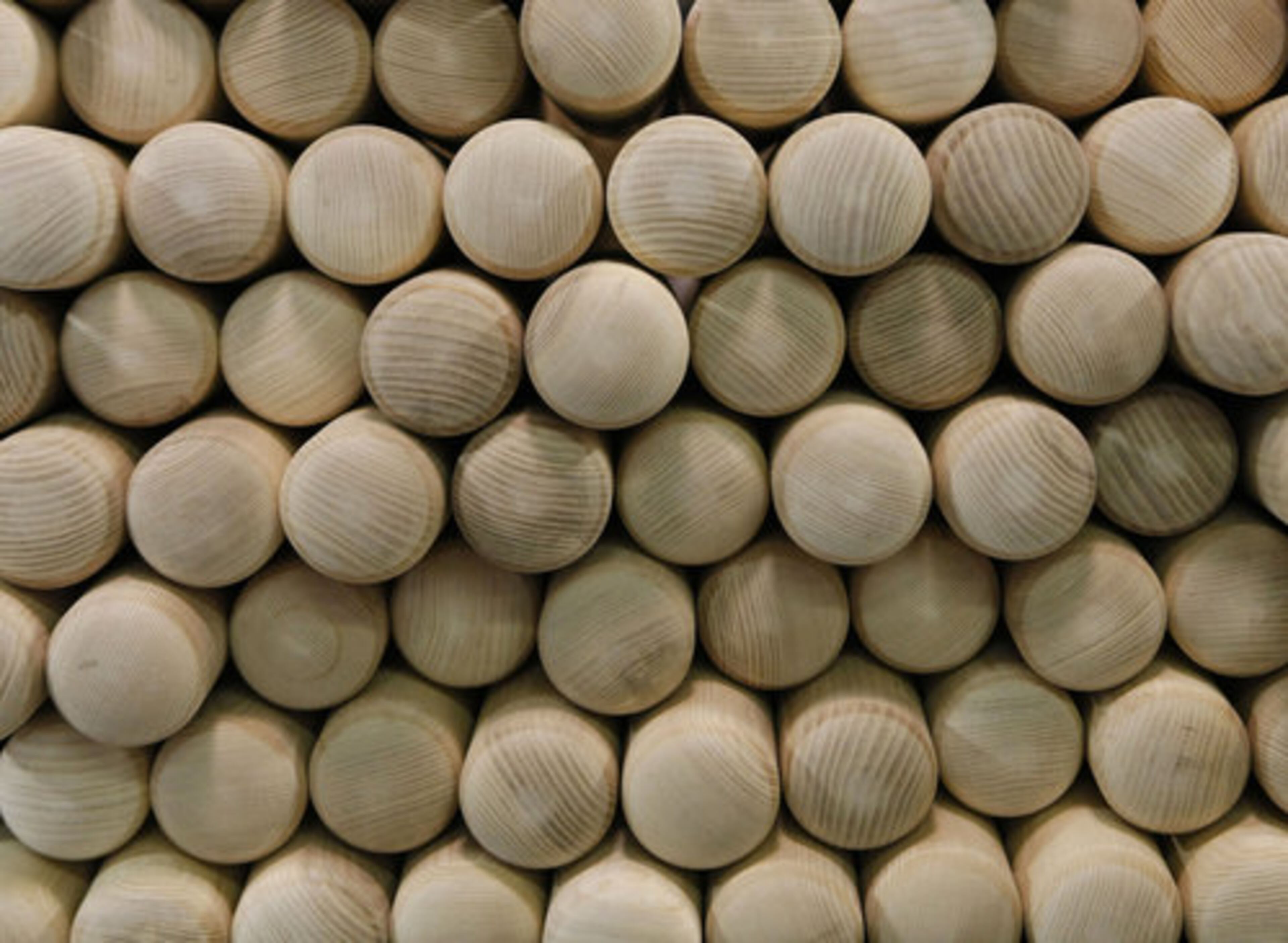 A stack of baseball bats wait in the Louisville Slugger Museum & Factory in Louisville, Ky.