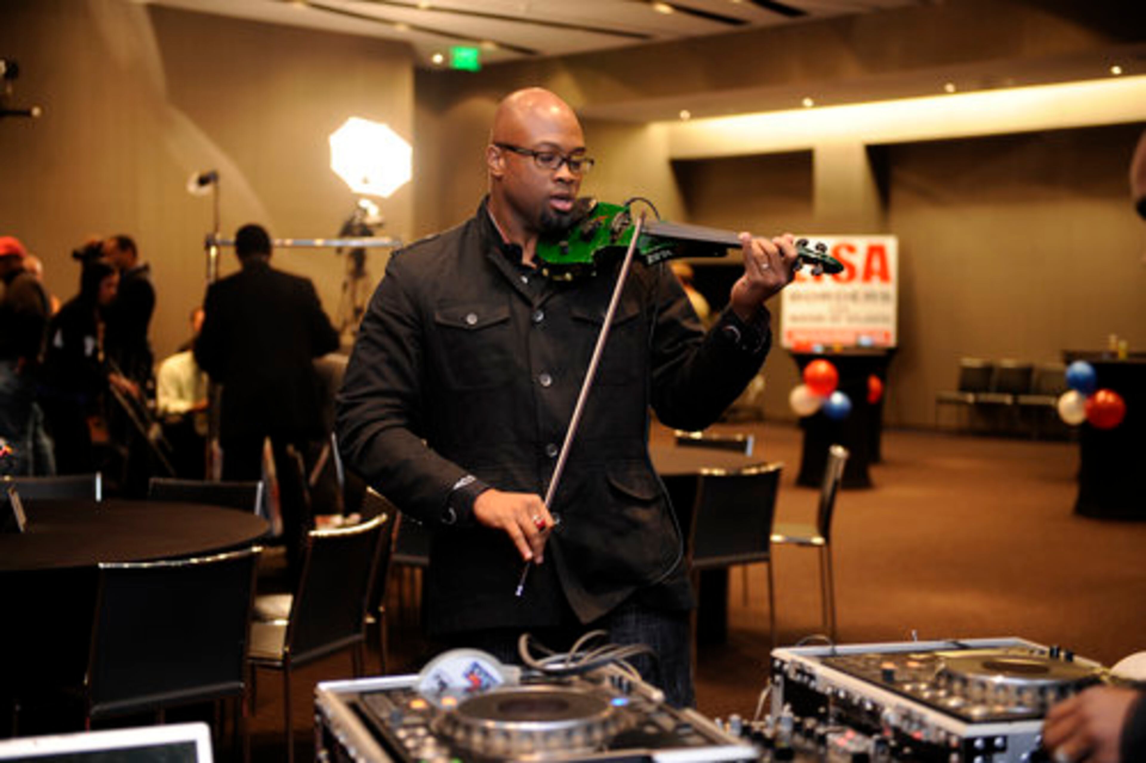Jazz Violinist Ken Ford preps for Lisa Borders event later this evening.