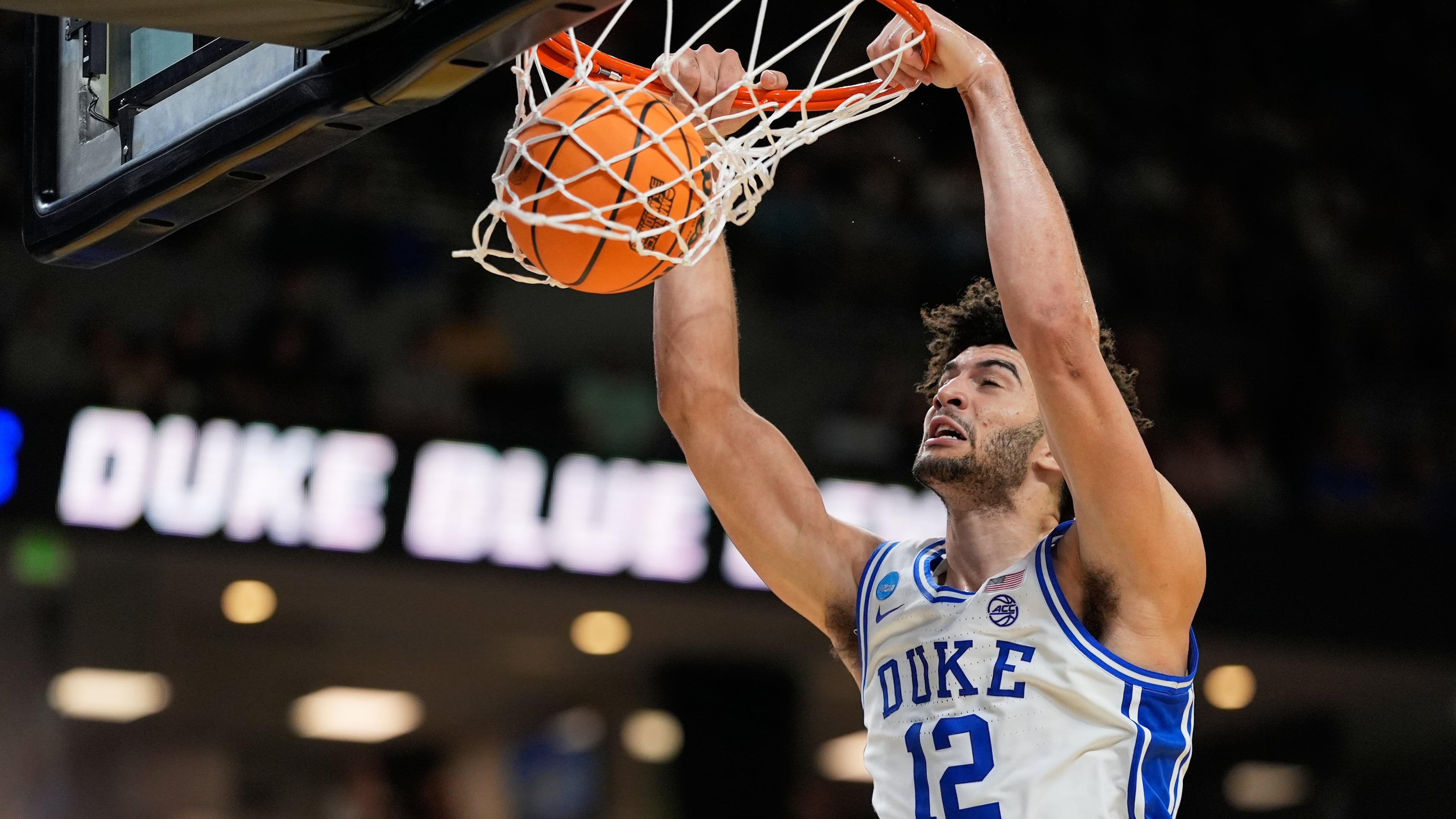 Duke forward Cameron Boozer dunks against TCU during the second half in the second round of the NCAA college basketball tournament, Saturday, March 21, 2026, in Greenville, S.C. (AP Photo/Chris Carlson)