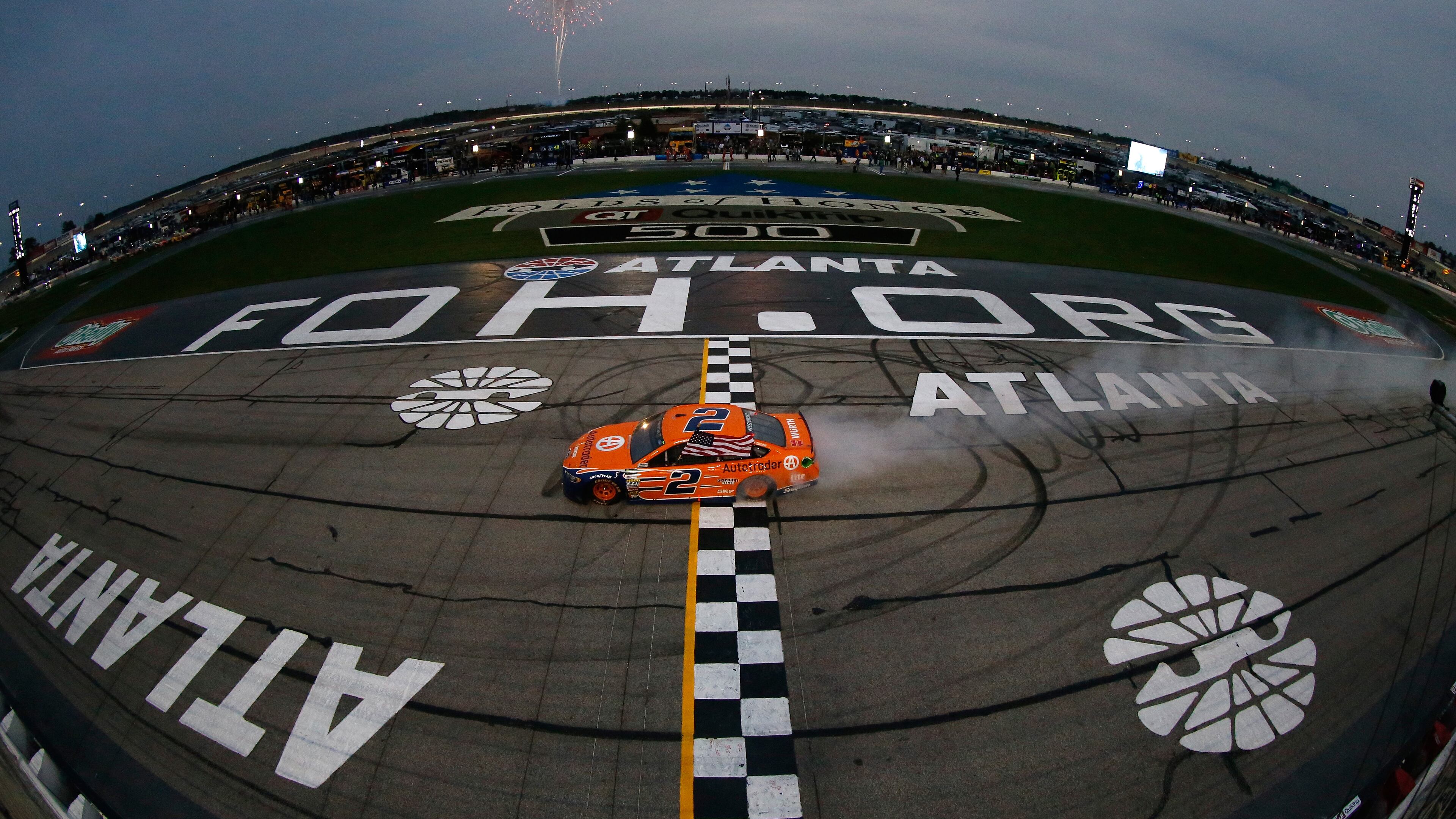 Brad Keselowski celebrates with a burnout after winning the Monster Energy NASCAR Cup Series Folds Of Honor QuikTrip 500 at Atlanta Motor Speedway March 5, 2017, in Hampton.