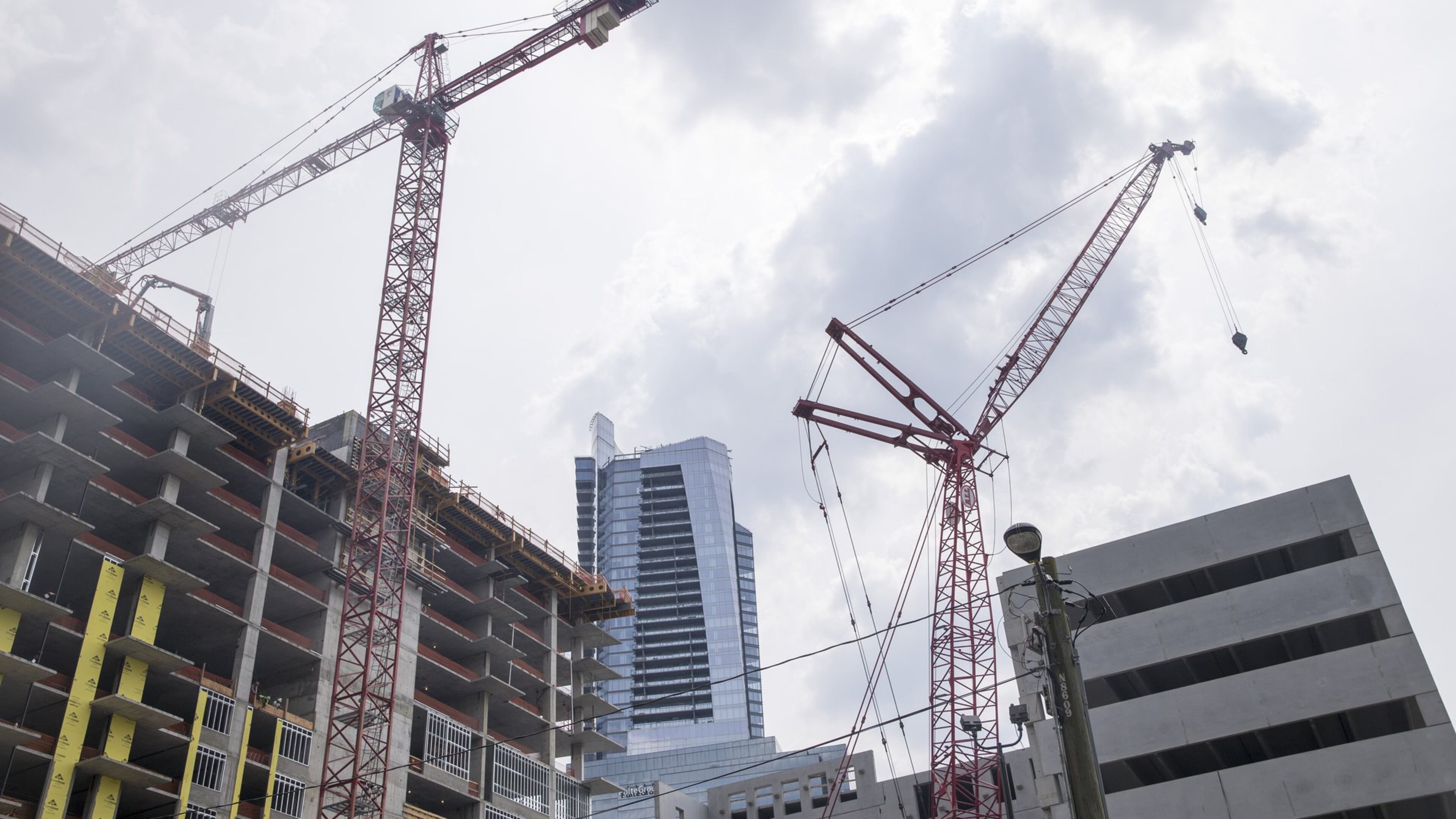 Construction cranes loom over the Related Group’s high-rise rental multifamily residential building, located on Peachtree Road, in Atlanta’s Buckhead community, Monday, May 14, 2018. (file photo) ALYSSA POINTER/ATLANTA JOURNAL-CONSTITUTION