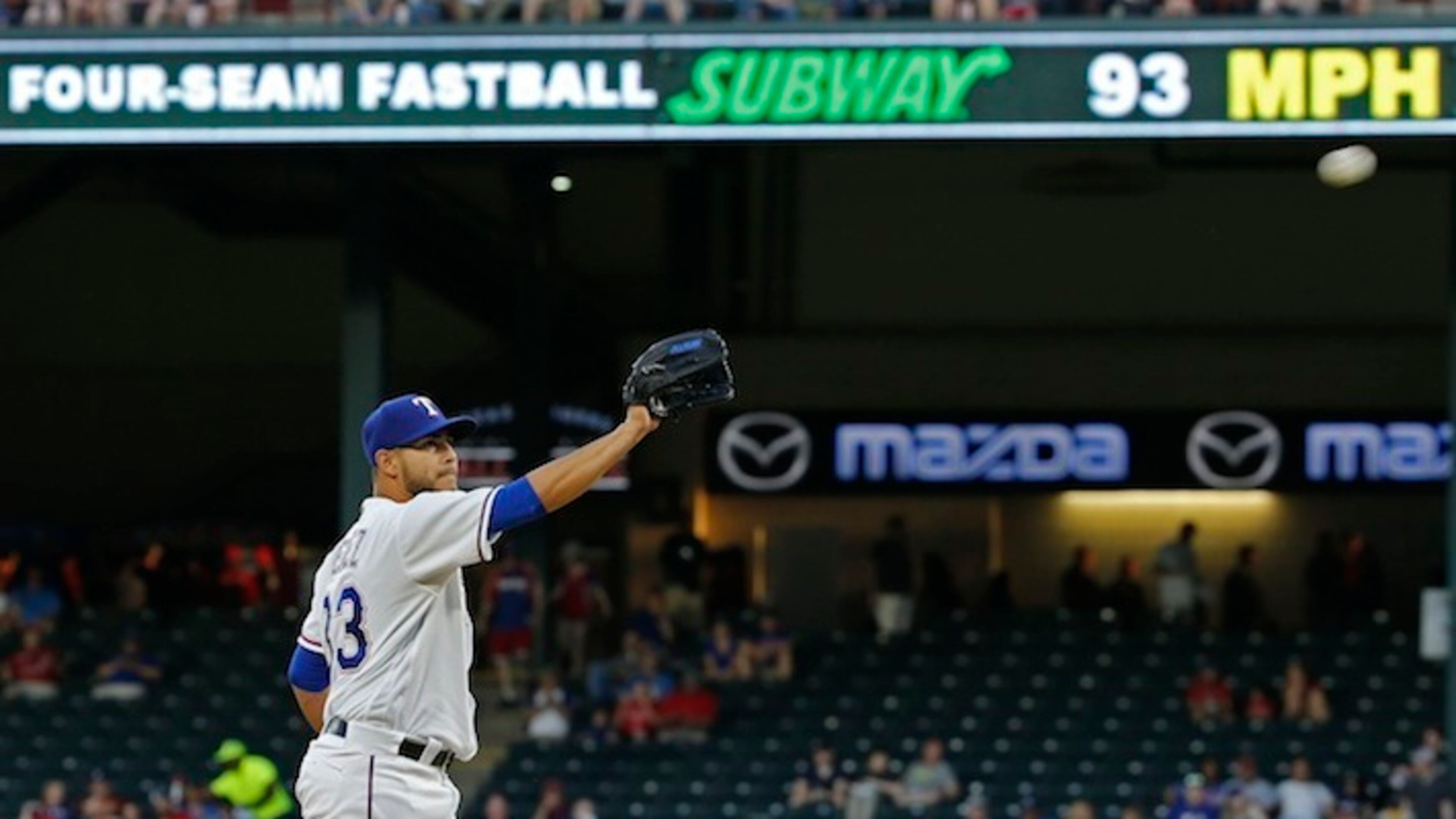 Texas Rangers starting pitcher Martin Perez (33) with the new pitch sign above his head (in right field) during a game against the Seattle Mariners on Tuesday, April 5, 2016, at Globe Life Park in Arlington, Texas. Real-time detailed pitch information, including type and velocity, is now standard at every park. The same data is also sent to the MLB At-Bat application used by fans on their computers, tablets and smartphones. (Paul Moseley/Fort Worth Star-Telegram/TNS)