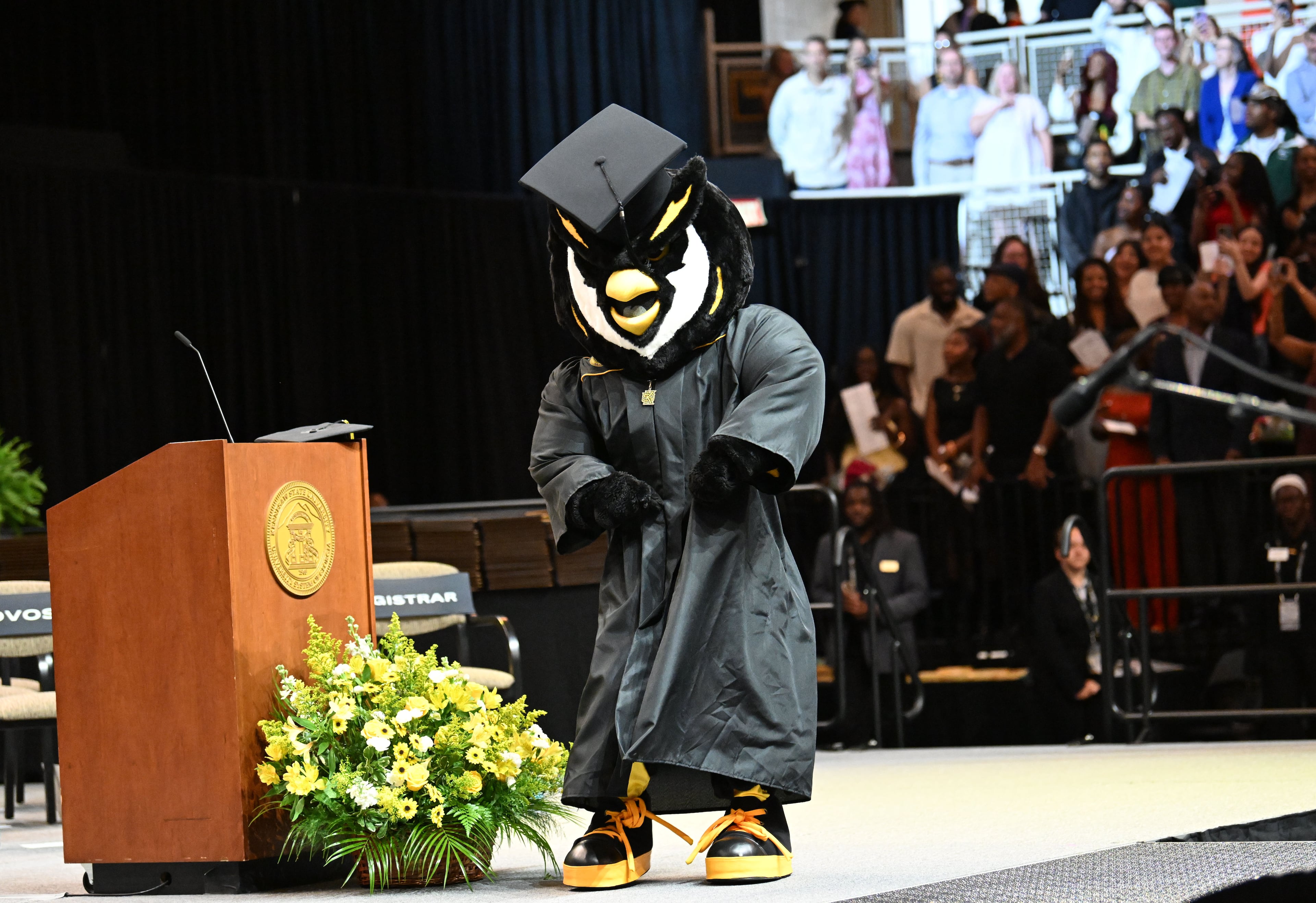 KSU mascot “Scrappy” entertains KSU graduates during commencement. Did they get a diploma? (Hyosub Shin/AJC)