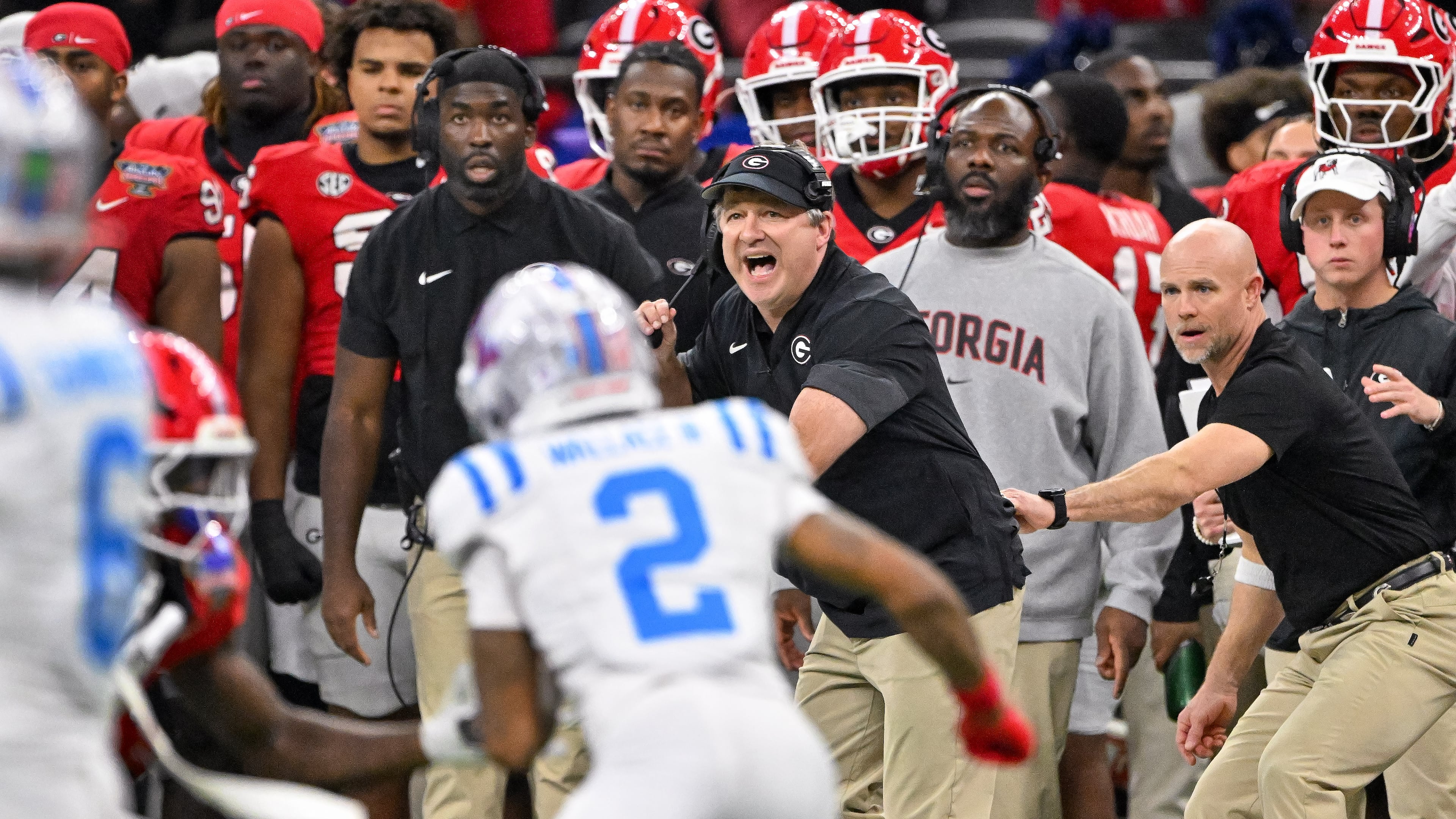 Georgia Bulldogs head coach Kirby Smart calls in a play against the Ole Miss Rebels during the second quarter of the NCAA College Football Playoff quarterfinal game at the Sugar Bowl in the Caesars Superdome, Thursday, Jan. 1, 2026, in New Orleans. (Hyosub Shin/AJC)