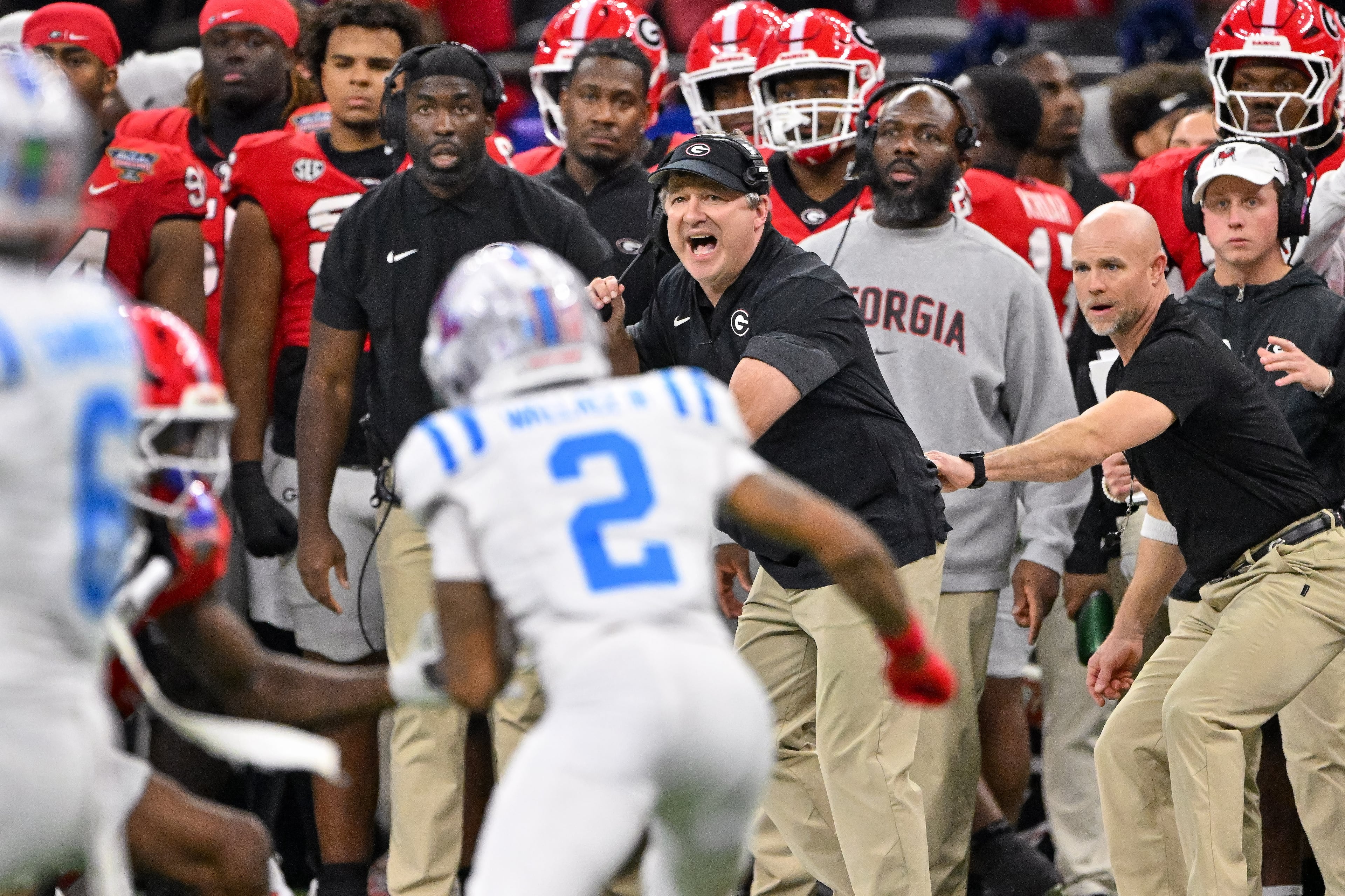Georgia Bulldogs head coach Kirby Smart calls in a play against the Ole Miss Rebels during the second quarter of the NCAA College Football Playoff quarterfinal game at the Sugar Bowl in the Caesars Superdome, Thursday, Jan. 1, 2026, in New Orleans. (Hyosub/AJC)
