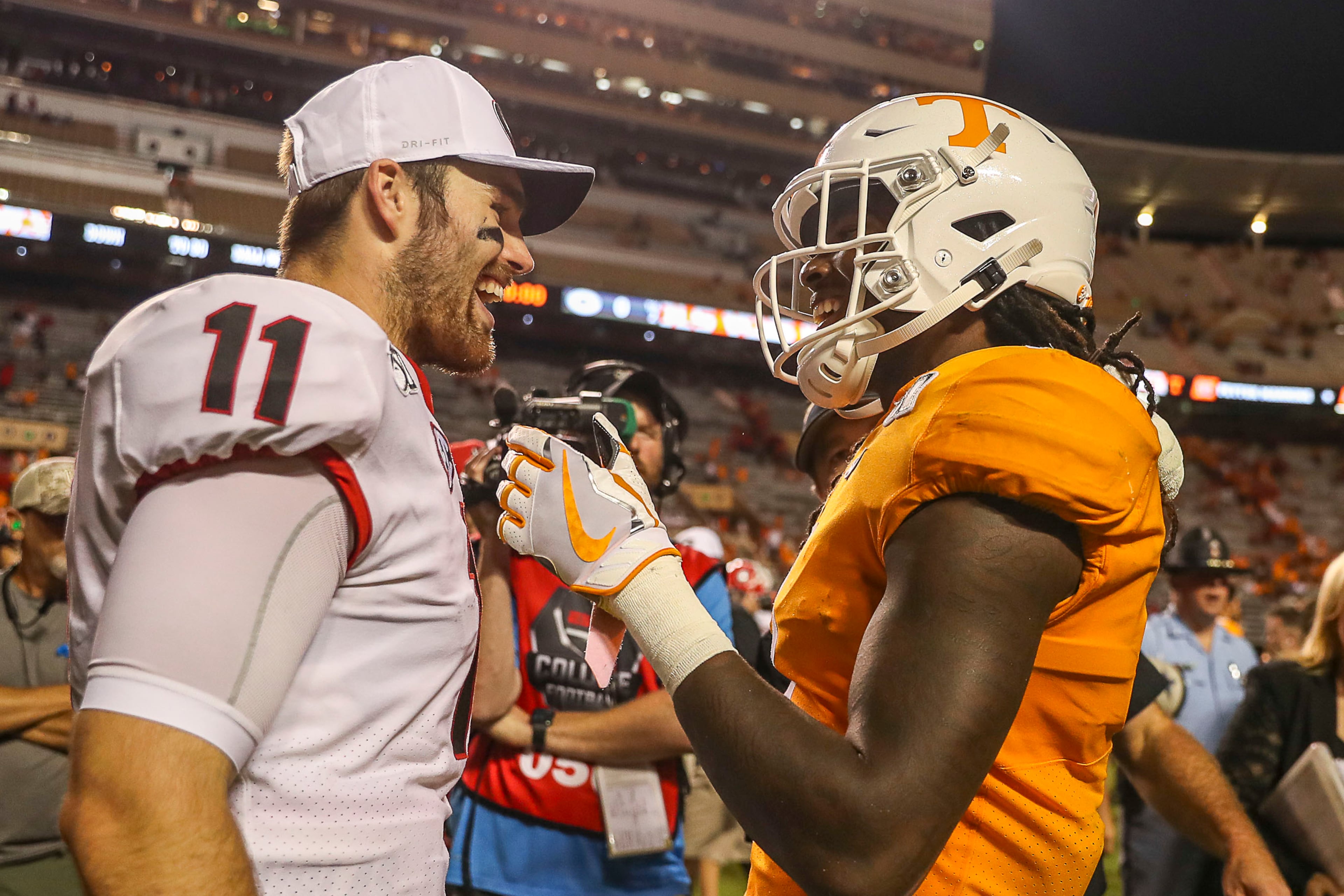 Georgia Bulldogs quarterback Jake Fromm (11) and Tennessee Volunteers wide receiver Marquez Callaway (1) speak following the game. (Alyssa Pointer/Atlanta Journal Constitution)