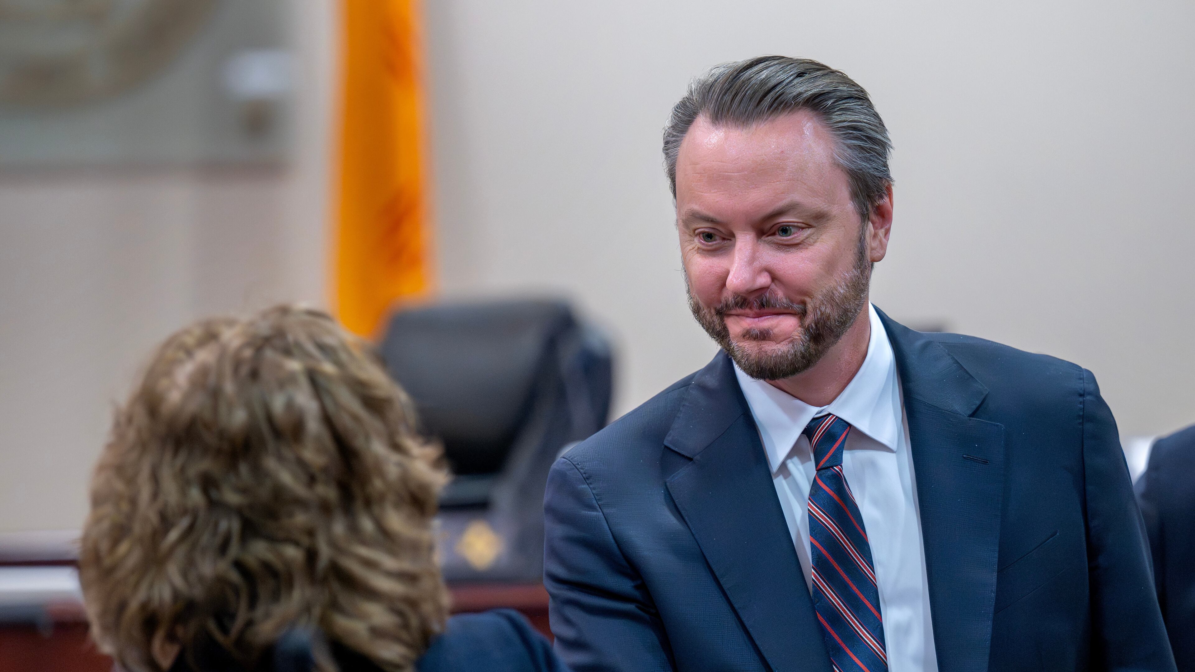Linda Singer, an attorney representing the plaintiff, left, shakes hands with attorney Kevin Huff, representing Meta, after they made closing arguments, Monday, March 23, 2026, in state court, in Santa Fe, N.M., in a trial where the social media conglomerate is accused of misleading its users about how safe its platforms are for children. (Eddie Moore/The Albuquerque Journal via AP, Pool)