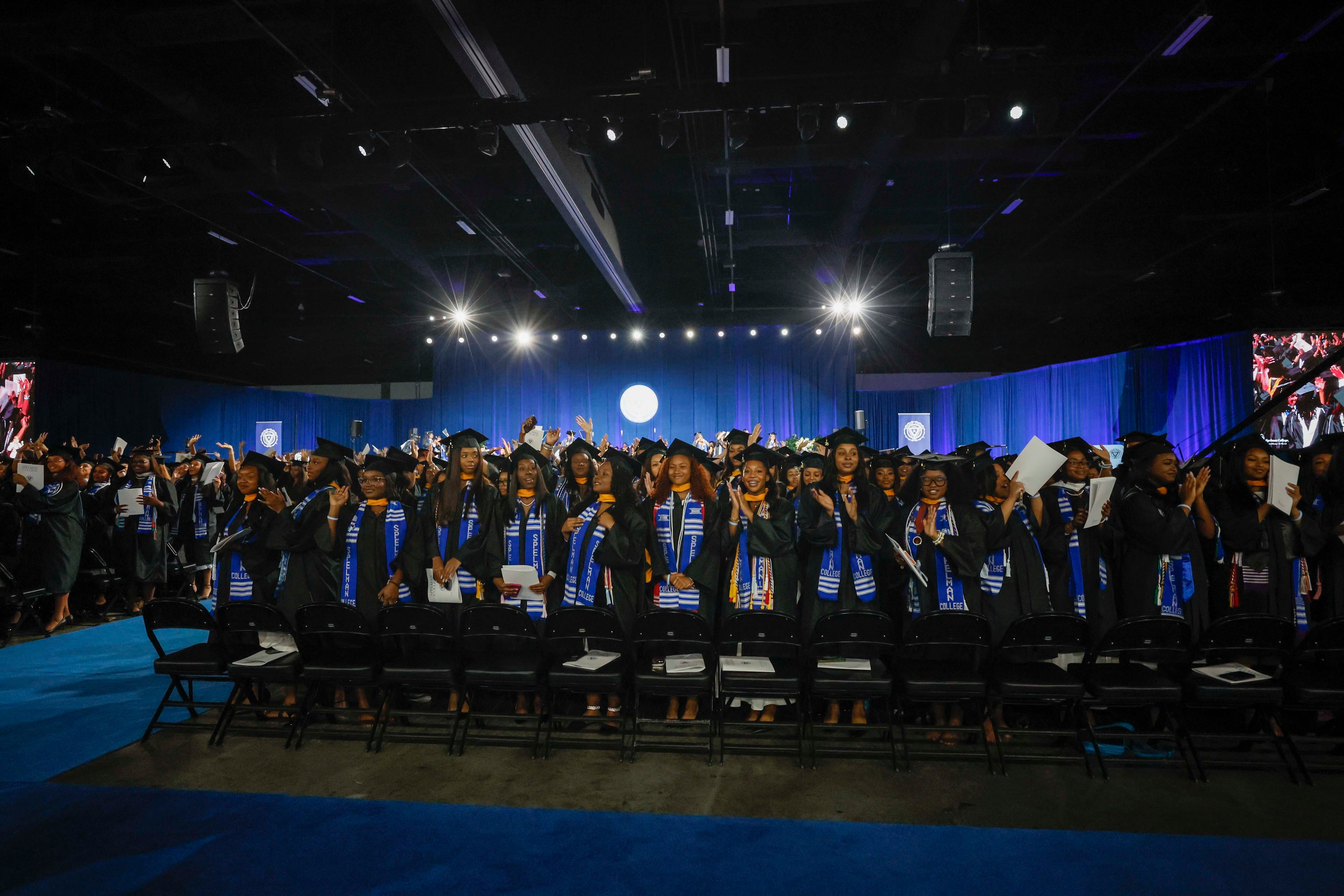 Graduates cheer for their families during the Spelman College Commencement ceremony at the Georgia International Convention Center in College Park on Sunday, May 17, 2026. (Miguel Martinez/AJC)