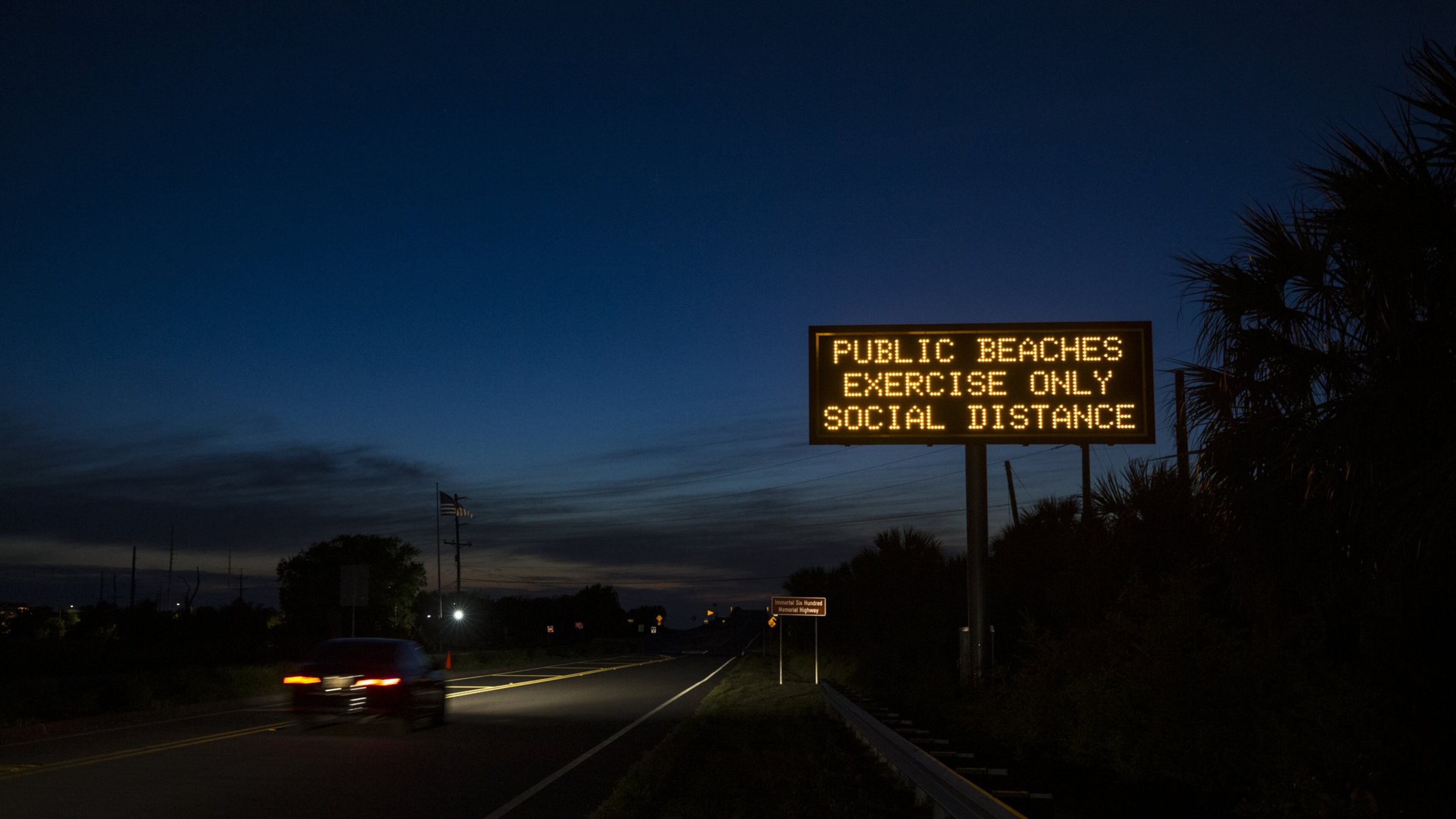 A GDOT sign, along the causeway to Tybee Island, informs motorists of Gov. Bryan Kemp’s executive order, allowing people to access the state’s beaches for exercise, with social distancing of at least 6 feet. Kemp’s statewide order supersedes local shelter-in-place mandates. (AJC Photo/Stephen B. Morton)