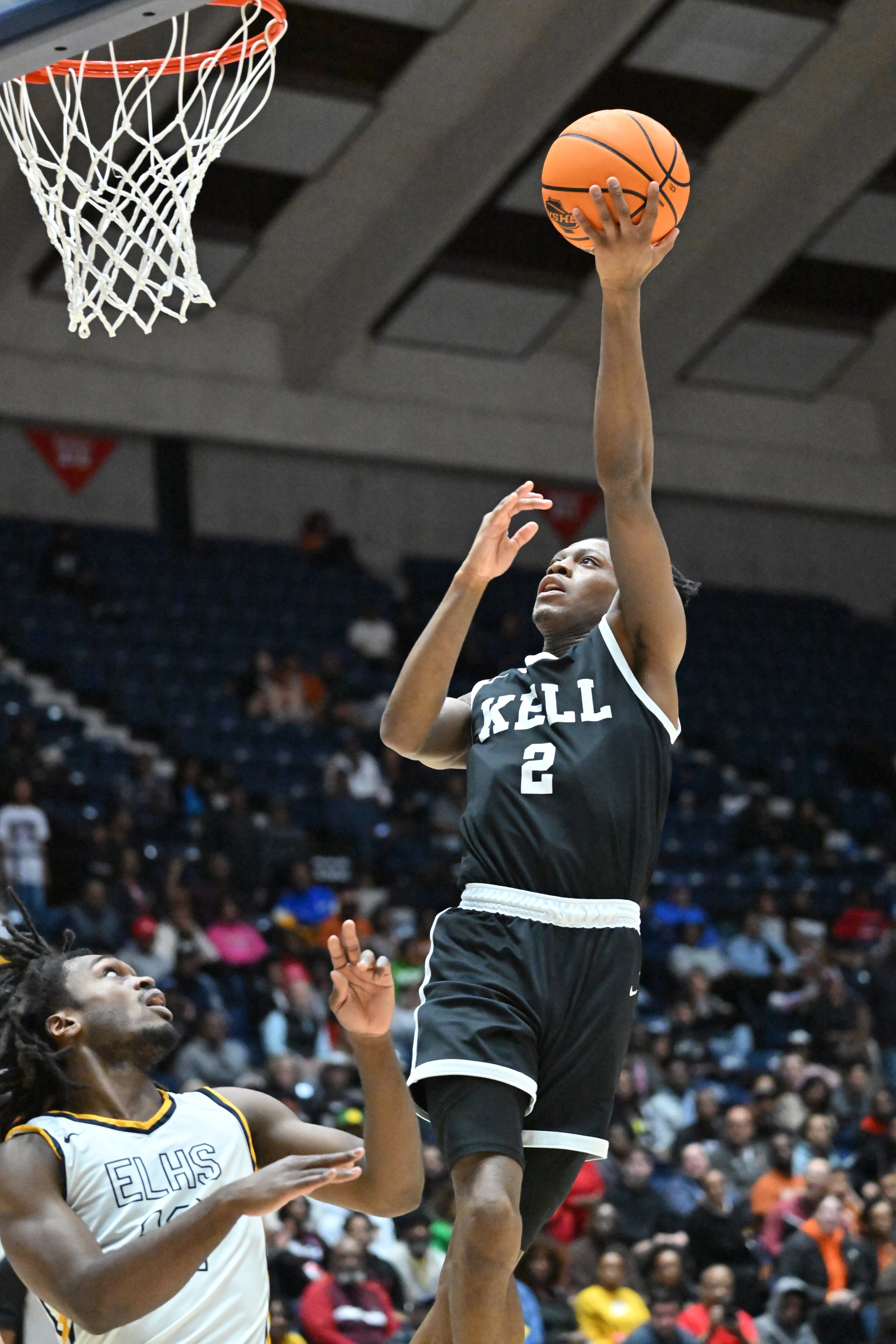 Kell’s Parrish Johnson Jr. shoots over Eagle’s Landing's David Thomas (12). (Hyosub Shin / Hyosub.Shin@ajc.com)