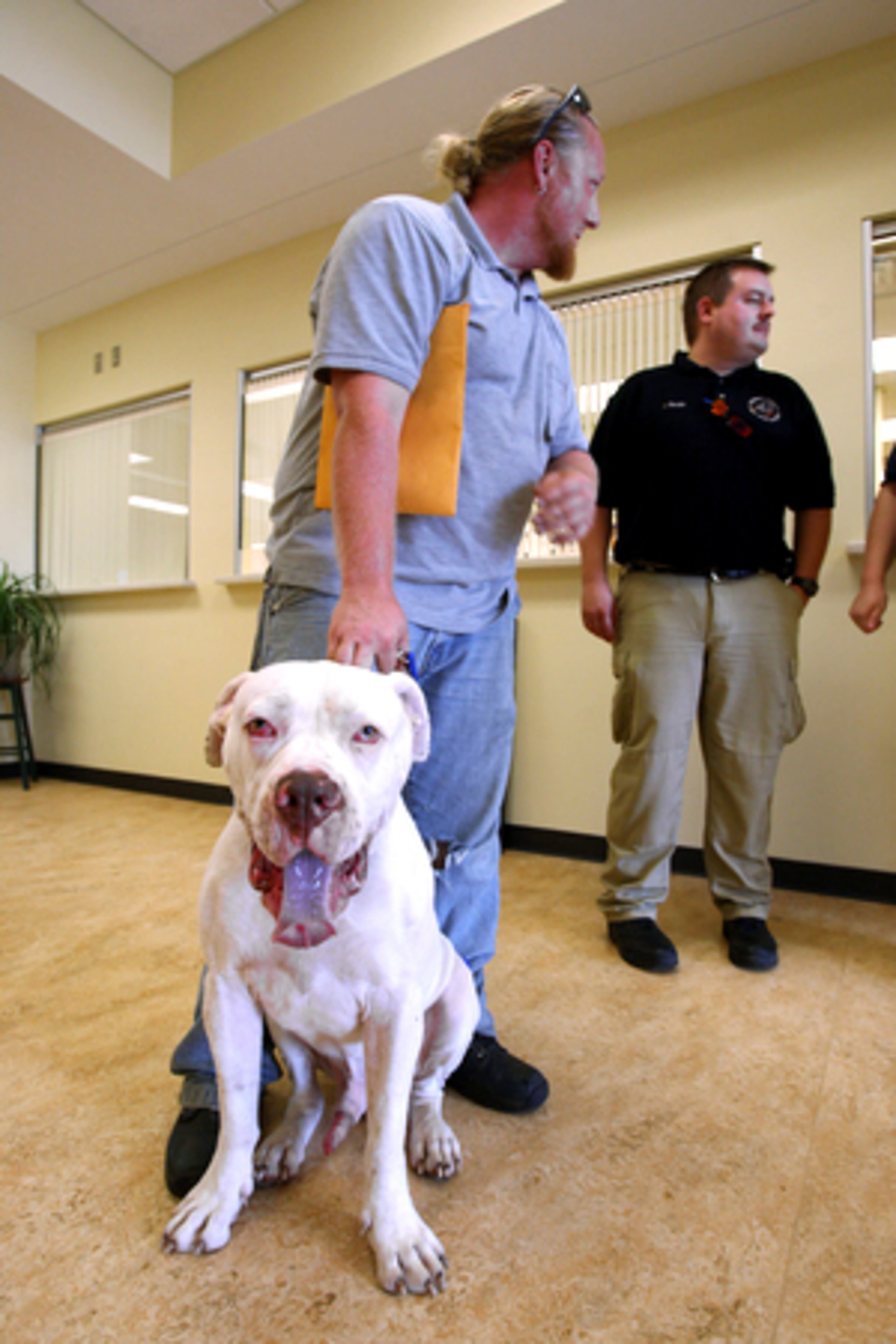 Jeremy Stegall, of Suwanee, was one of the first members of the public to use the services at the new Gwinnett County Animal Welfare and Enforcement Center facilities in Lawrenceville. His American bulldog "Hauss" got out through a hole in a yard fence and was picked up and brought there.