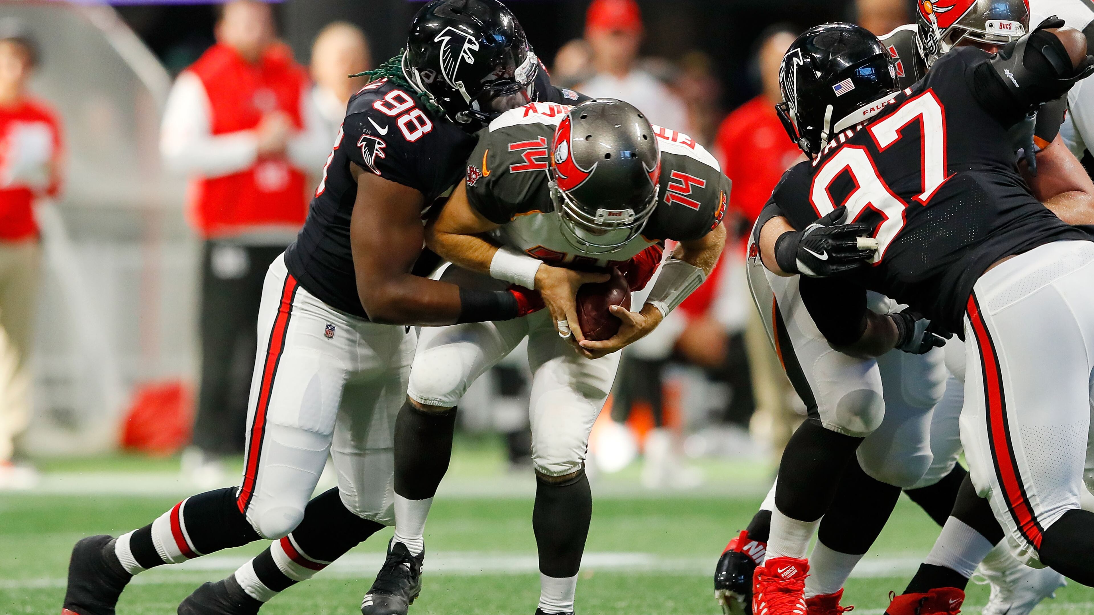 Falcons rookie defensive end Takk McKinley sacks Ryan Fitzpatrick of the Buccaneers in the second half at Mercedes-Benz Stadium on November 26 in Atlanta.