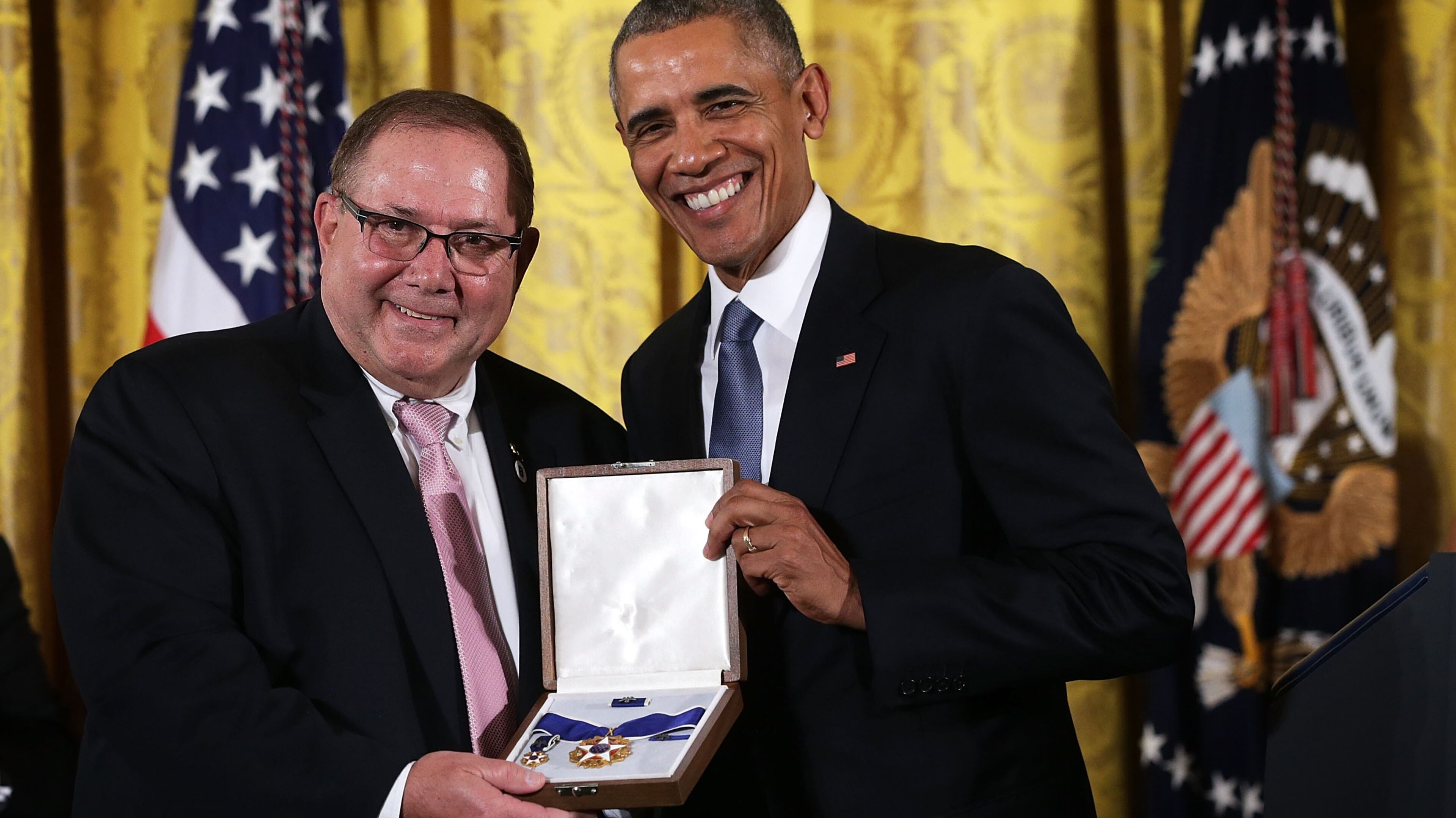 WASHINGTON, DC - NOVEMBER 24: Larry Berra (L), son of baseball legend Yogi Berra, receives the Presidential Medal of Freedom on behalf of his father from U.S. President Barack Obama (R) during an East Room ceremony November 24, 2015 at the White House in Washington, DC. Seventeen recipients were awarded with the nationÃs highest civilian honor. (Photo by Alex Wong/Getty Images)