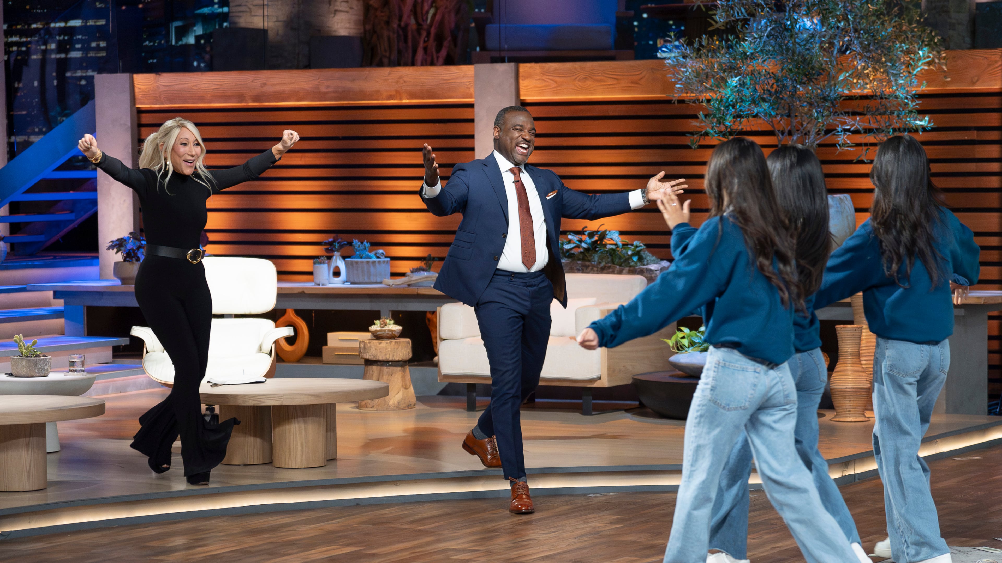 Lori Greiner and guest Shark Rashaun Williams, a minority owner in the Atlanta Falcons, close a deal with entrepreneurs Victoria Yang, Nikki Varanasi and Lucy Yang during the Season 17 finale of Shark Tank that aired April 22, 2026, on ABC. (Disney/Christopher Willard)