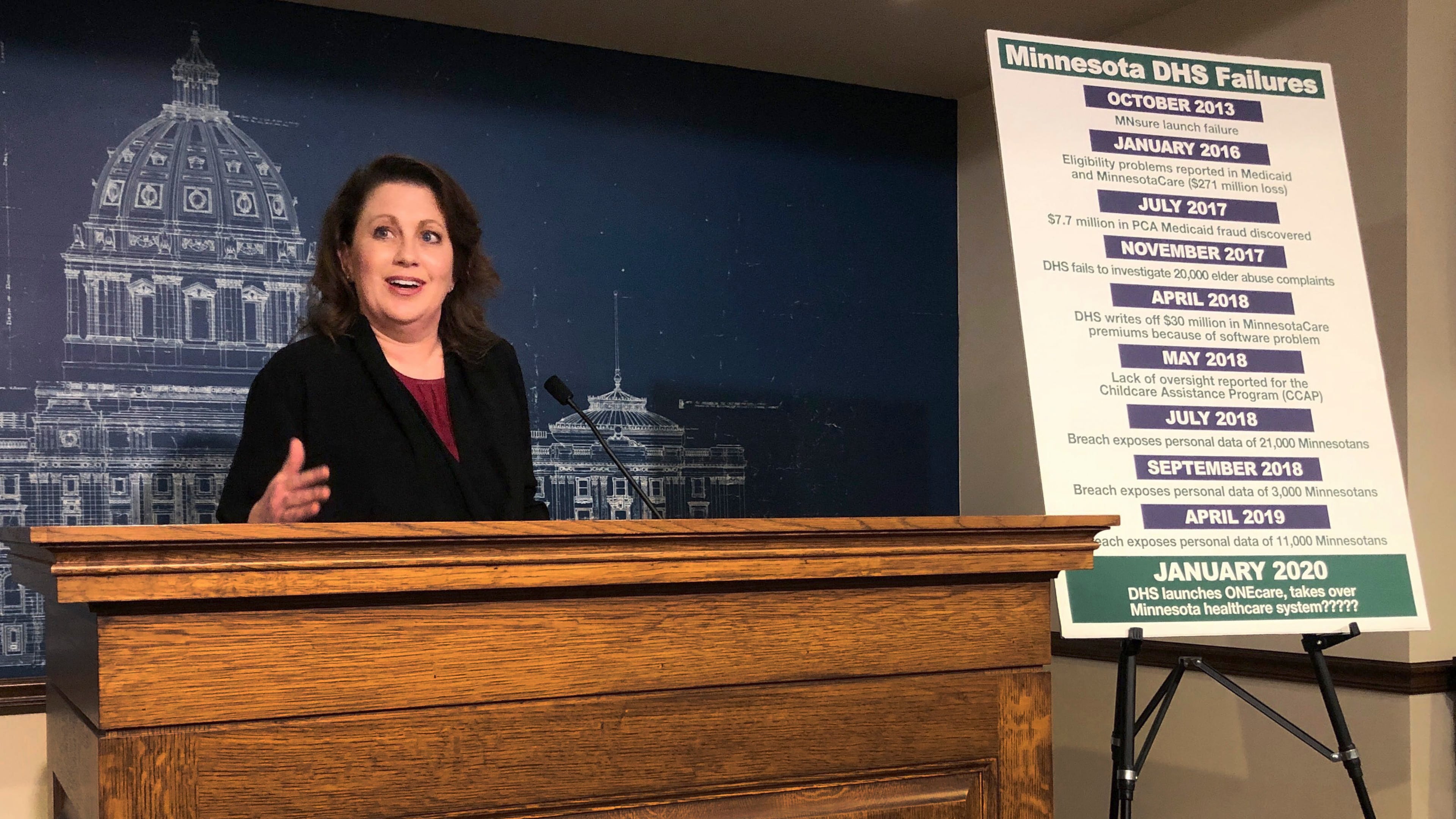 FILE - State Sen. Michelle Benson reacts at a news conference on Wednesday, April 10, 2019 at the Minnesota State Capitol in St. Paul to a report by the state's legislative auditor on combatting fraud in Minnesota's Child Care Assistance Program. (AP Photo/Steve Karnowski,File)