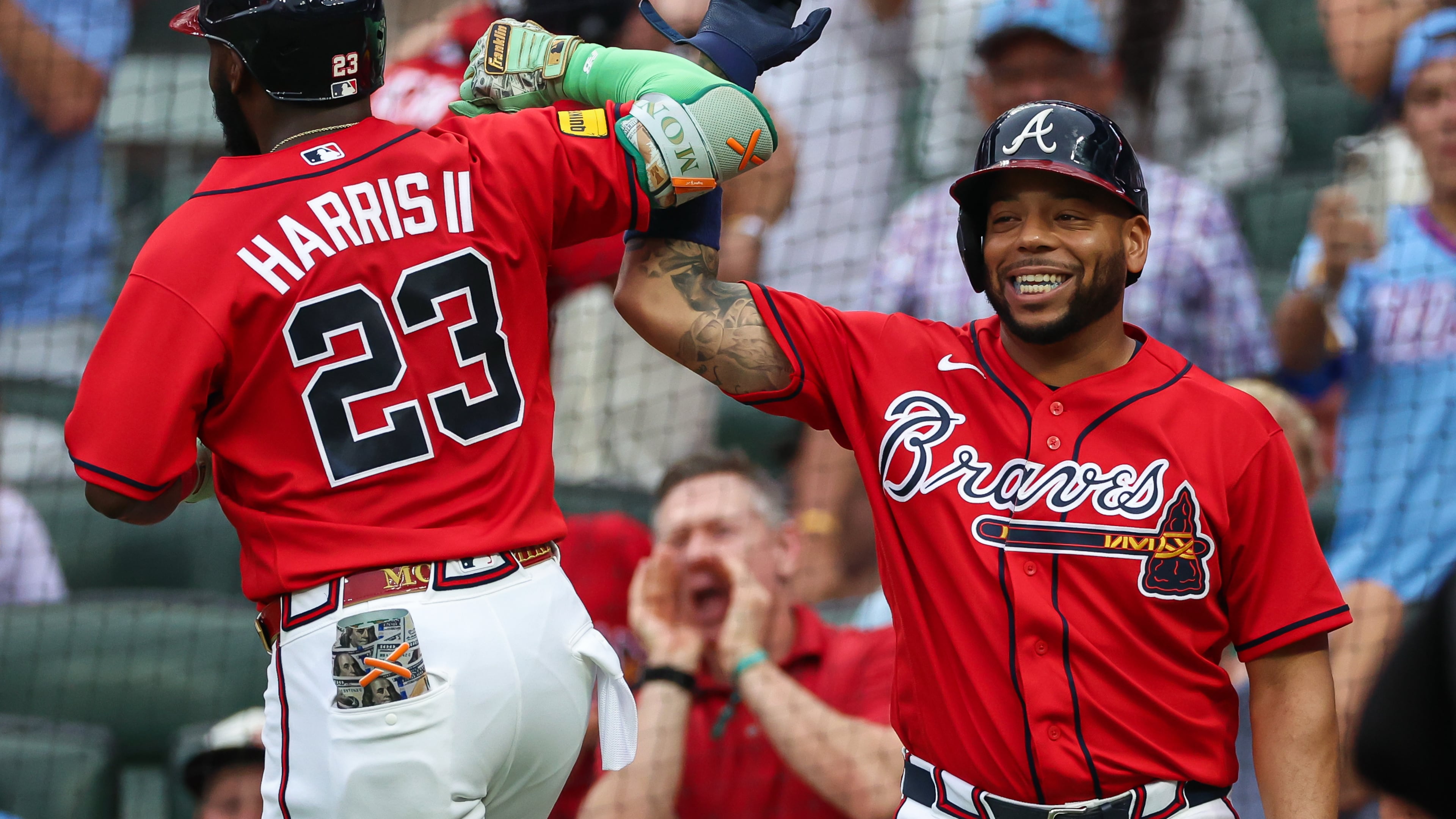 Atlanta Braves' Michael Harris II (23) reacts with Dominic Smith, right, after hitting a two-run home run in the second inning of a baseball game against the New York Mets, Friday, July 3, 2026, in Atlanta. (AP Photo/Colin Hubbard)