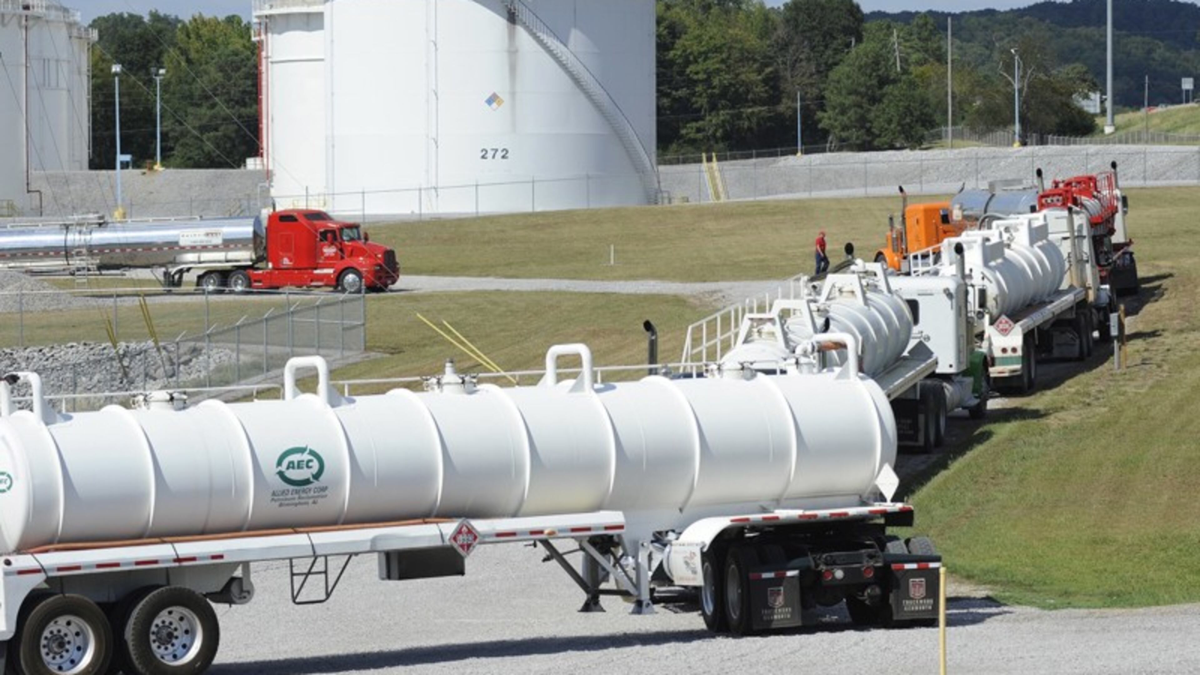 Tanker trucks line up at a Colonial Pipeline facility in Pelham, Ala. The Alpharetta company’s 5,500-mile network is the nation’s biggest. (AP Photo/Jay Reeves)