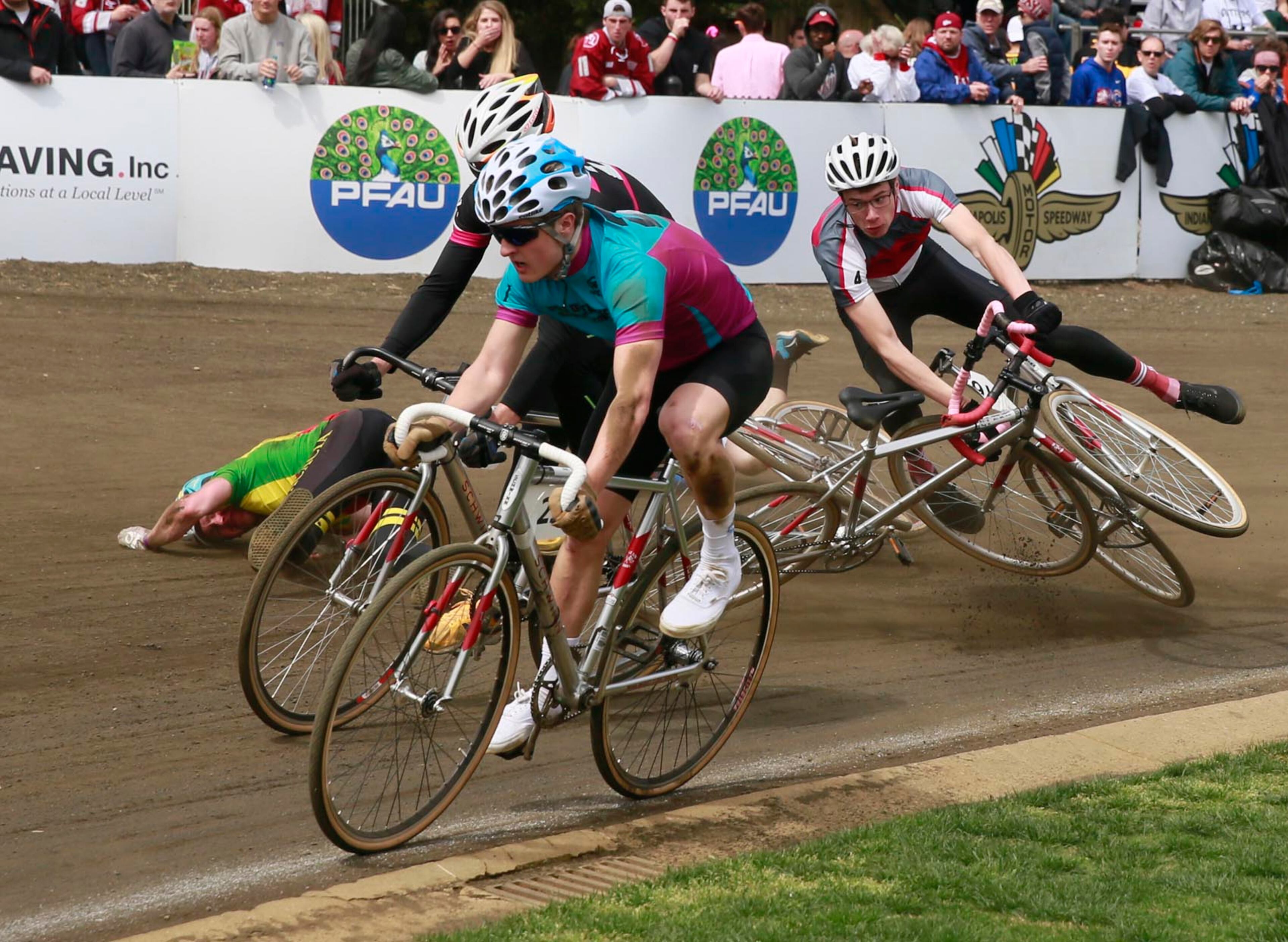 Riders crash in Turn 3 during the men's Little 500 bicycling race Saturday, April 22, 2017, at Indiana University in Bloomington, Ind. (Jeremy Hogan/The Herald-Times via AP)