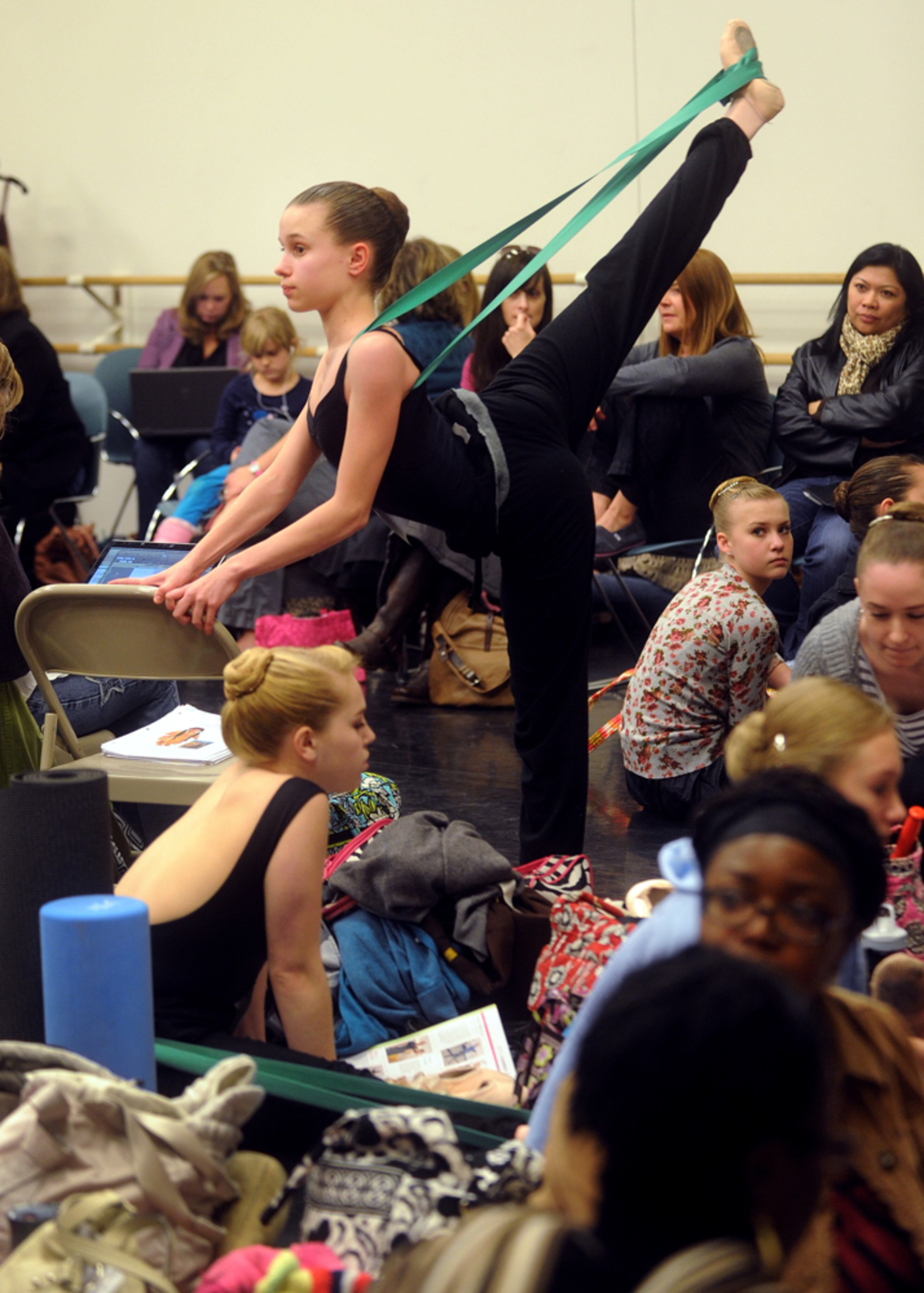 Jan. 6, 2013 Atlanta -- Madeline Ganter, 14, of Alpharetta warms up before auditioning for the School of American Ballet's 2013 Summer Courses Sunday, Jan. 6, 2013 at the Atlanta Ballet. About 140 hopefuls came to audition in Atlanta. Only 200 of the more than 2,000 aspiring ballet dancers who audition during the 20-city tour will land spots in the New York City School's five-week summer program.The School of American Ballet, founded 79 years ago by legendary choreographer George Balanchine and Lincoln Kirstein, is the premier ballet academy in the United States and trains more students who become professional ballet dancers than any other American school. SAB's former students fill the ranks of the New York City Ballet and other leading U.S. and international ballet companies. BITA HONARVAR / BHONARVAR@AJC.COM