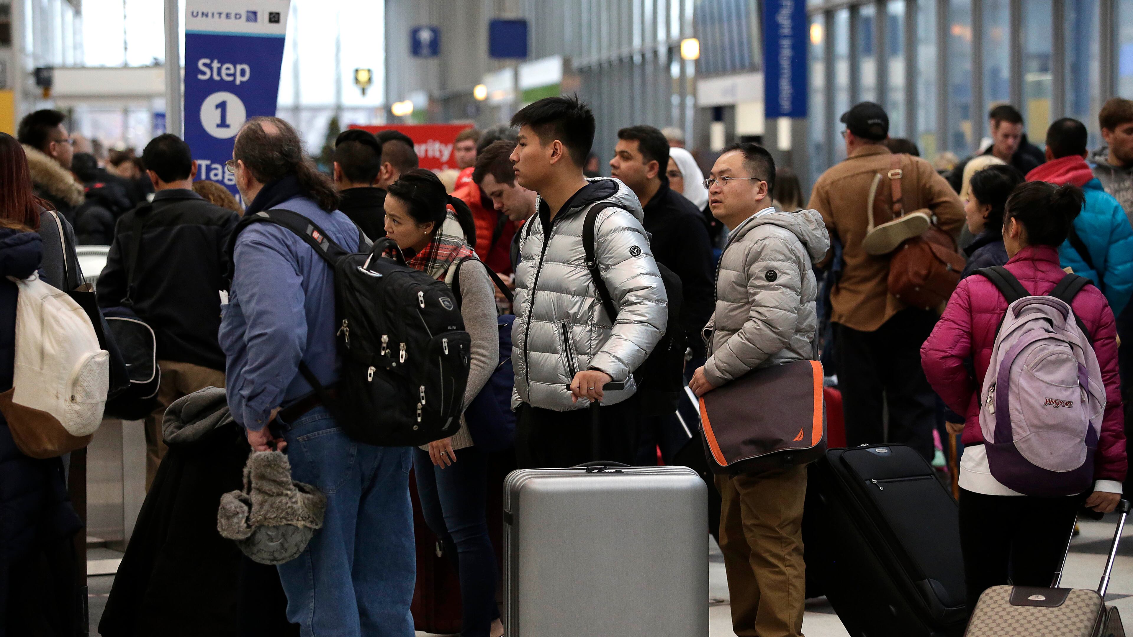 CHICAGO, IL - DECEMBER 23 : Travelers wait in line to check-in for flights at O'Hare International Airport on December 23, 2016 in Chicago, Illinois. O'hare International Airport is one of the busiest hubs in the nation during the weeks surrounding Christmas and New Years. Travel blog The Points Guy ranked the airport among the worst of 2016. (Photo by Joshua Lott/Getty Images)