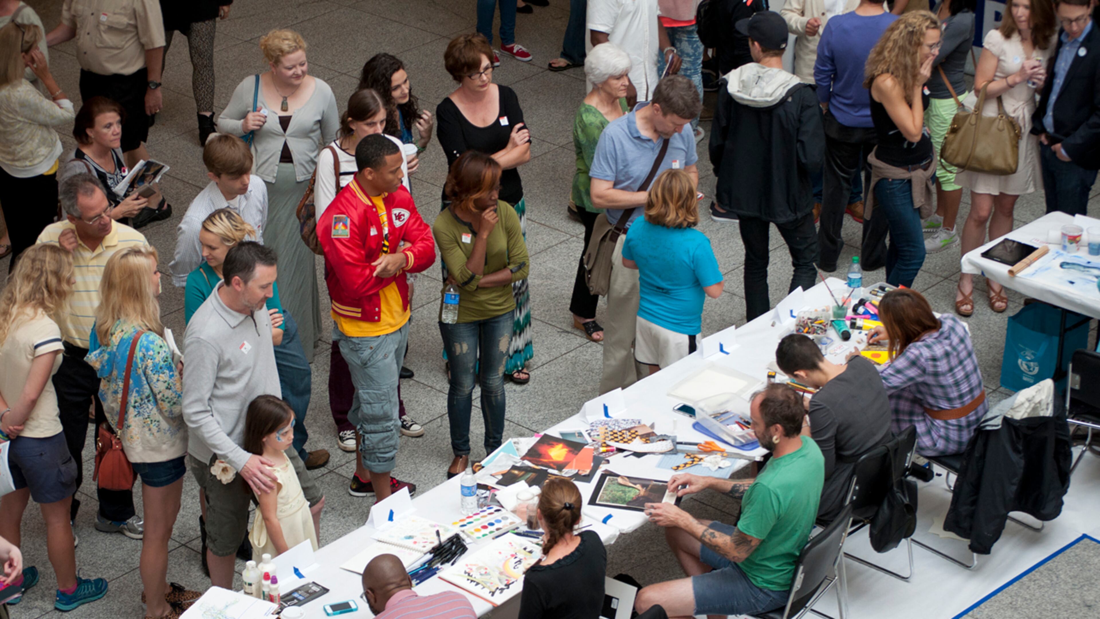Patrons check out what artists were creating at the first "Monster Drawing Rally" in 2013. The event will be staged again on Saturday, with 75 artists creating new drawings for sale at the High Museum of Art. CONTRIBUTED BY HIGH MUSEUM