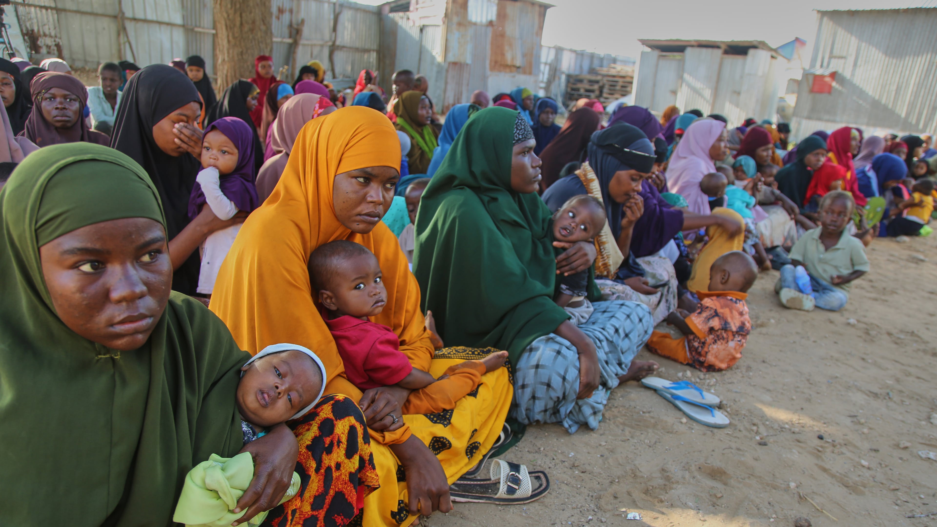 Somali women displaced by drought sit at Feynuus Nutrition Centre on the outskirts of the capital, Mogadishu, Somalia Wednesday, Aug. 19, 2026. (AP Photo/Farah Abdi Warsameh)