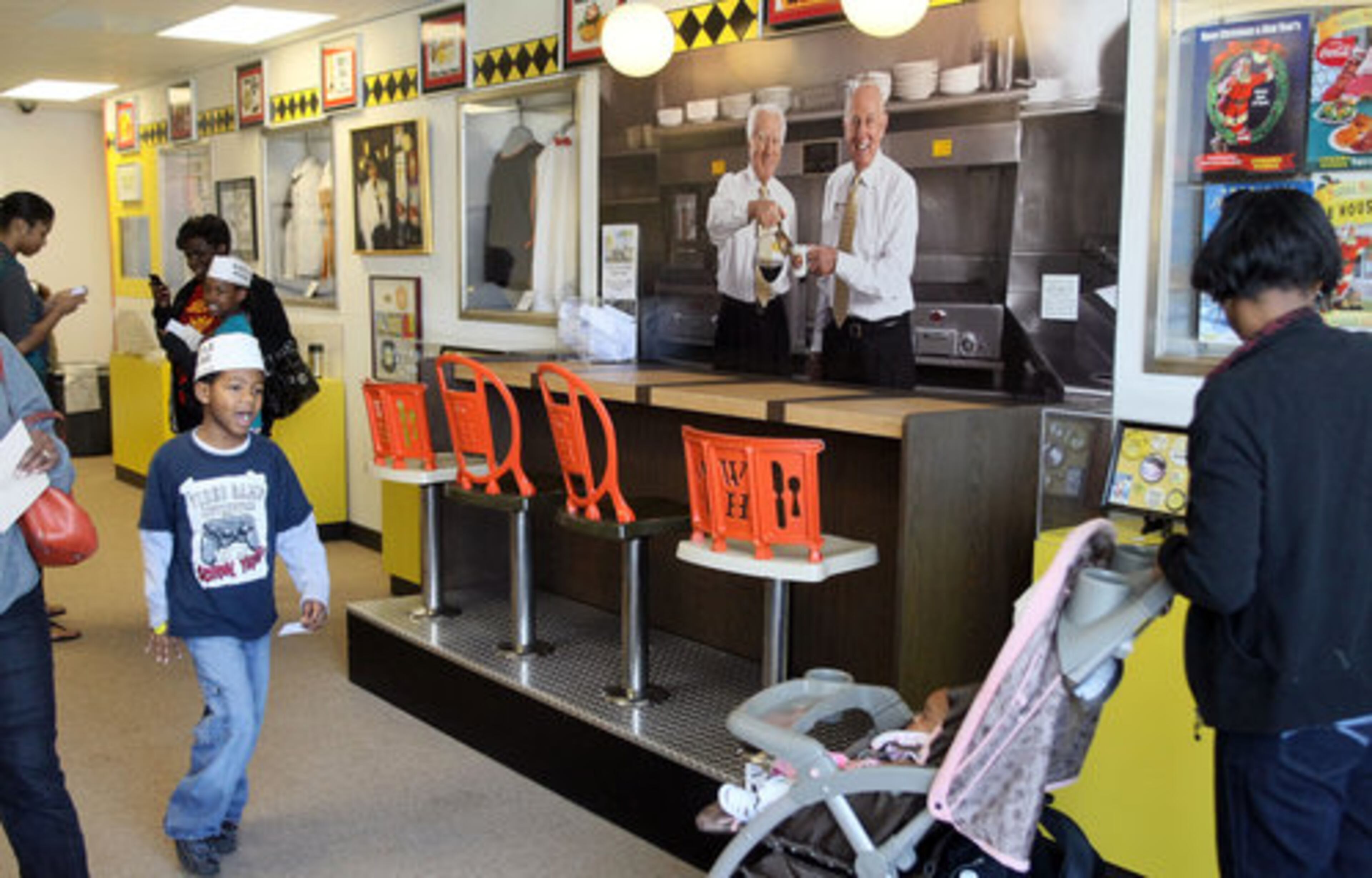 Visitors stroll the Waffle House Museum. It's the site of the very first Waffle House restaurant, which opened in 1955 after two neighbors, Joe Roger Sr. and Tom Forkner, decided the Avondale Estates neighborhood needed a 24-hour restaurant.