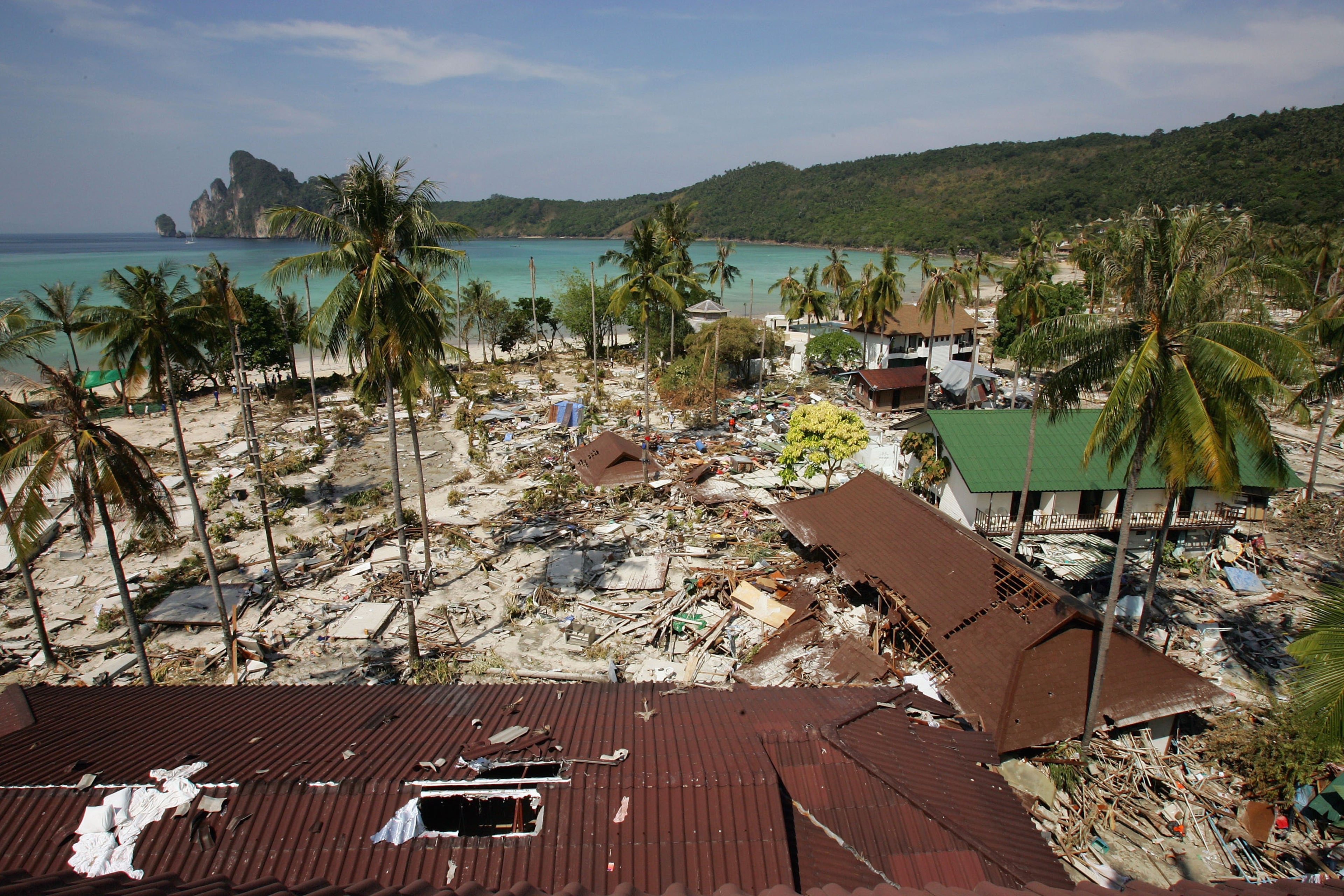 PHI PHI ISLAND, THAILAND - DECEMBER 28: All over Ton Sai Bay, the heart of Koh Phi Phi shops, restaurants and bungalows were totally wiped out following a Tsunami December 28, 2004 on Phi Phi Island, Thailand. Hundreds were killed when an earthquake caused a Tsunami wave destroying everything in its path. The powerful Asian earthquake has effected coastal areas in Indonesia, Sri Lanka, India, and tourist isles of Thailand. The death toll is over 20,000. (Photo by Paula Bronstein/Getty Images)
