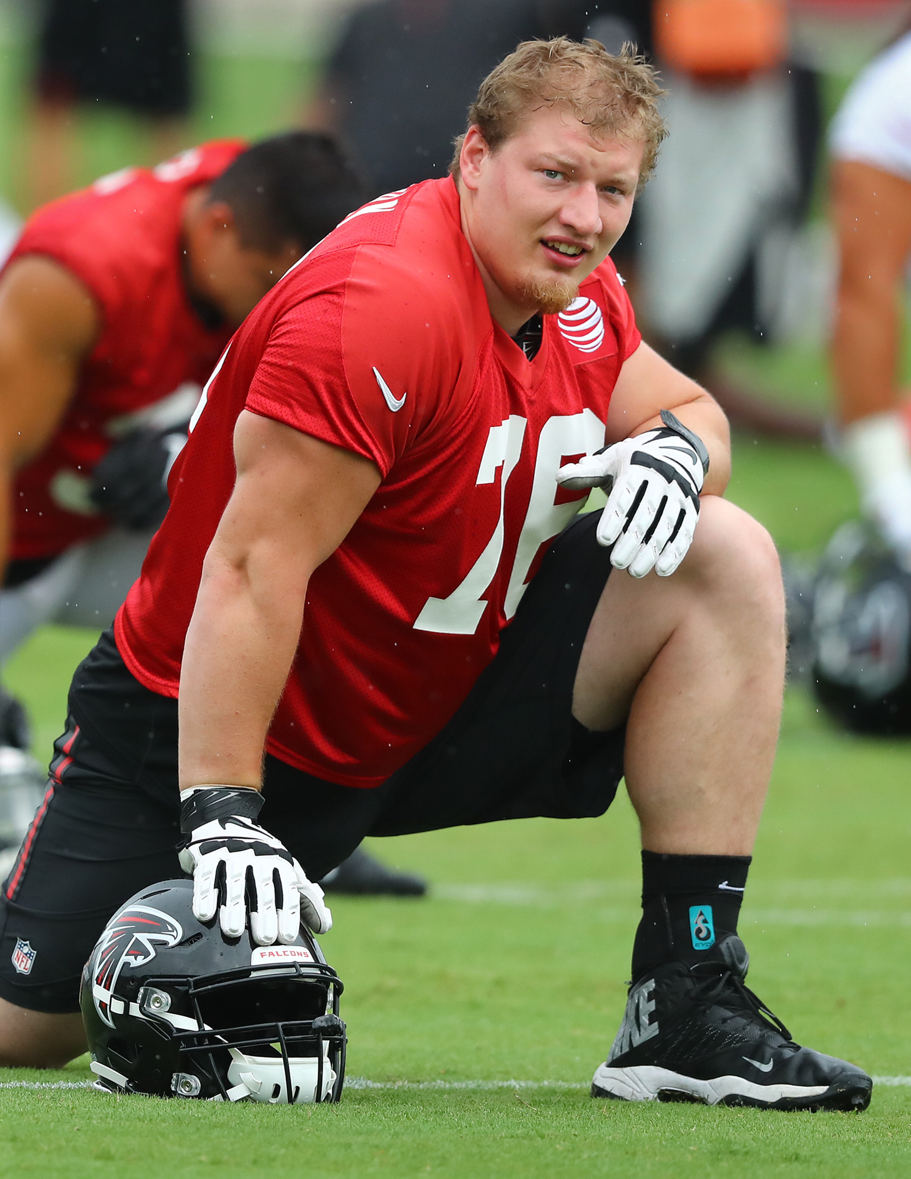 Falcons offensive tackle Kaleb McGary loosens up. Curtis Compton/ccompton@ajc.com