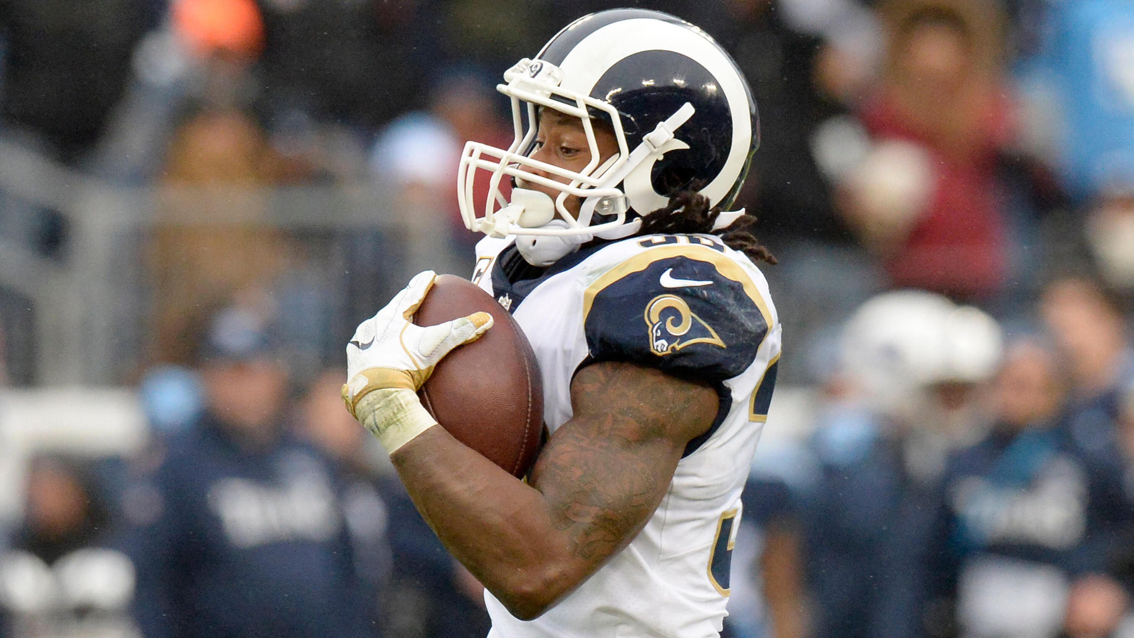 Los Angeles Rams running back Todd Gurley scores a touchdown on an 80-yard pass reception against the Tennessee Titans in the first half of an NFL football game Sunday, Dec. 24, 2017, in Nashville, Tenn. (AP Photo/Mark Zaleski)
