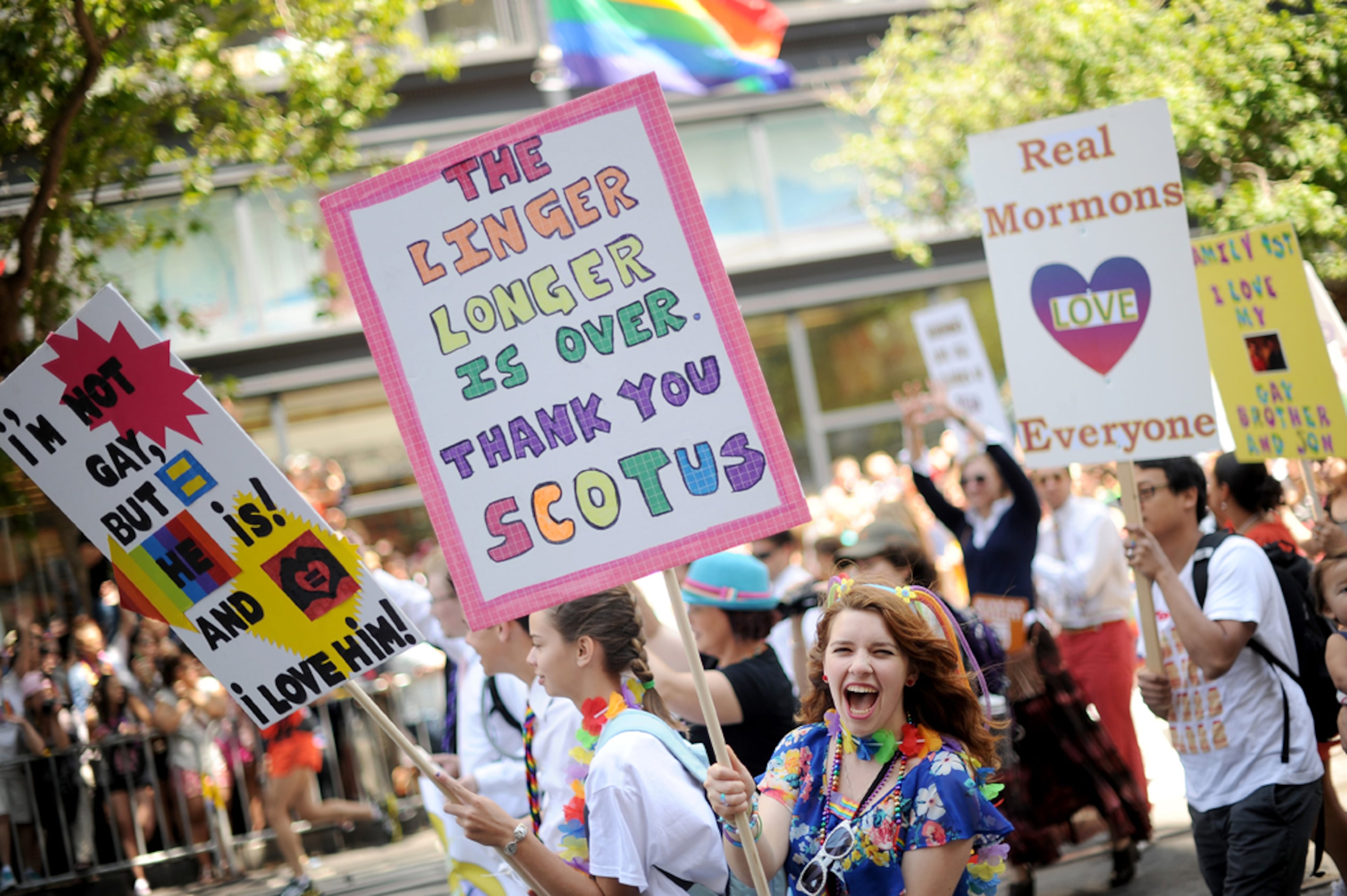 Dsiree Chavez bears a sign thanking the U.S. Supreme Court for clearing the way for same-sex marriage in California while marching in San Francisco's 43rd annual Gay Pride parade Sunday, June 30, 2013. Chavez walked as part of a Mormons for Marriage Equality contingent. (AP Photo/Noah Berger)