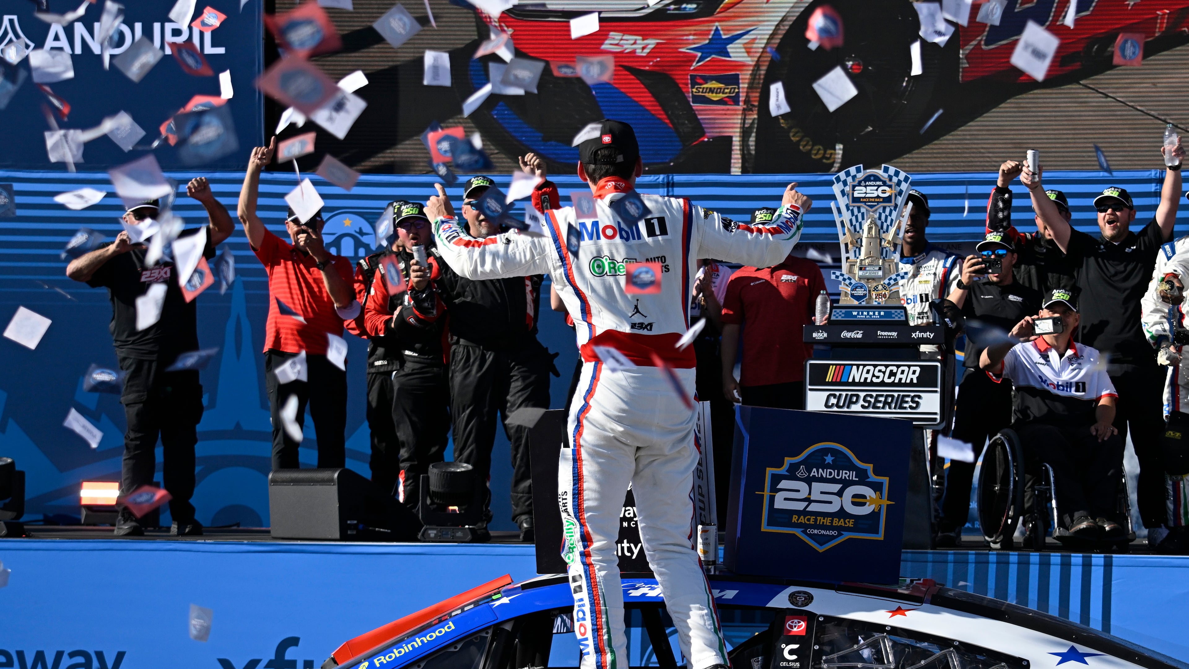 Cory Heim, center, celebrates in Victory Lane after winning a NASCAR Cup Series auto race, Sunday, June 21, 2026, in Coronado, Calif. (AP Photo/Denis Poroy)