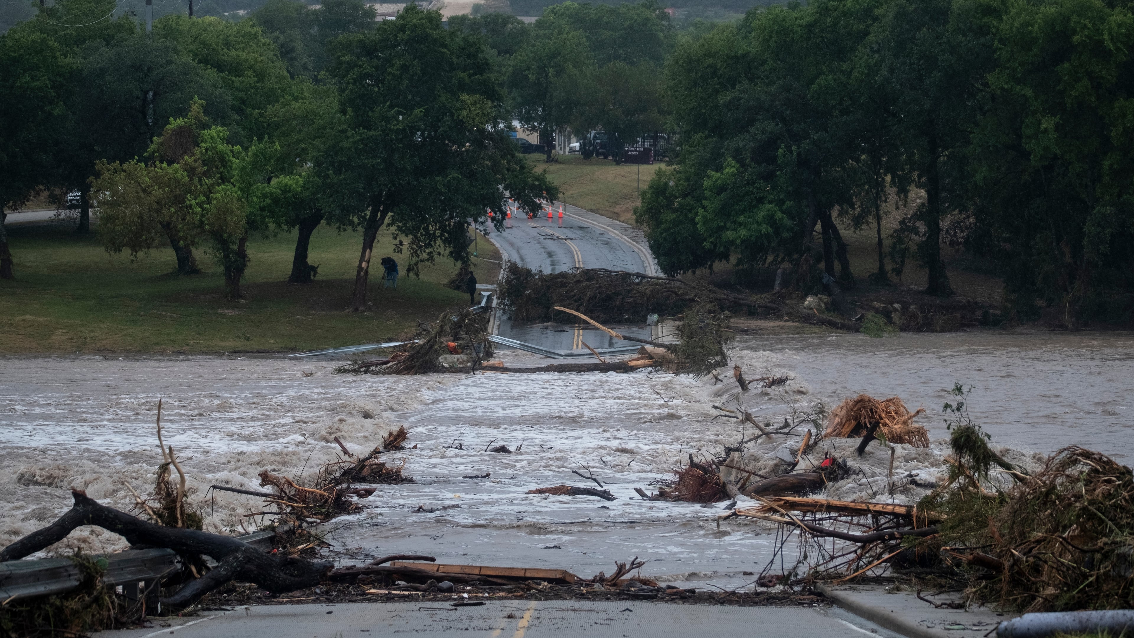 Flooding blocks off G Street along the Guadalupe River on Thursday, July 16, 2026, in Kerrville, Texas. (AP Photo/Joel Angel Juarez)
