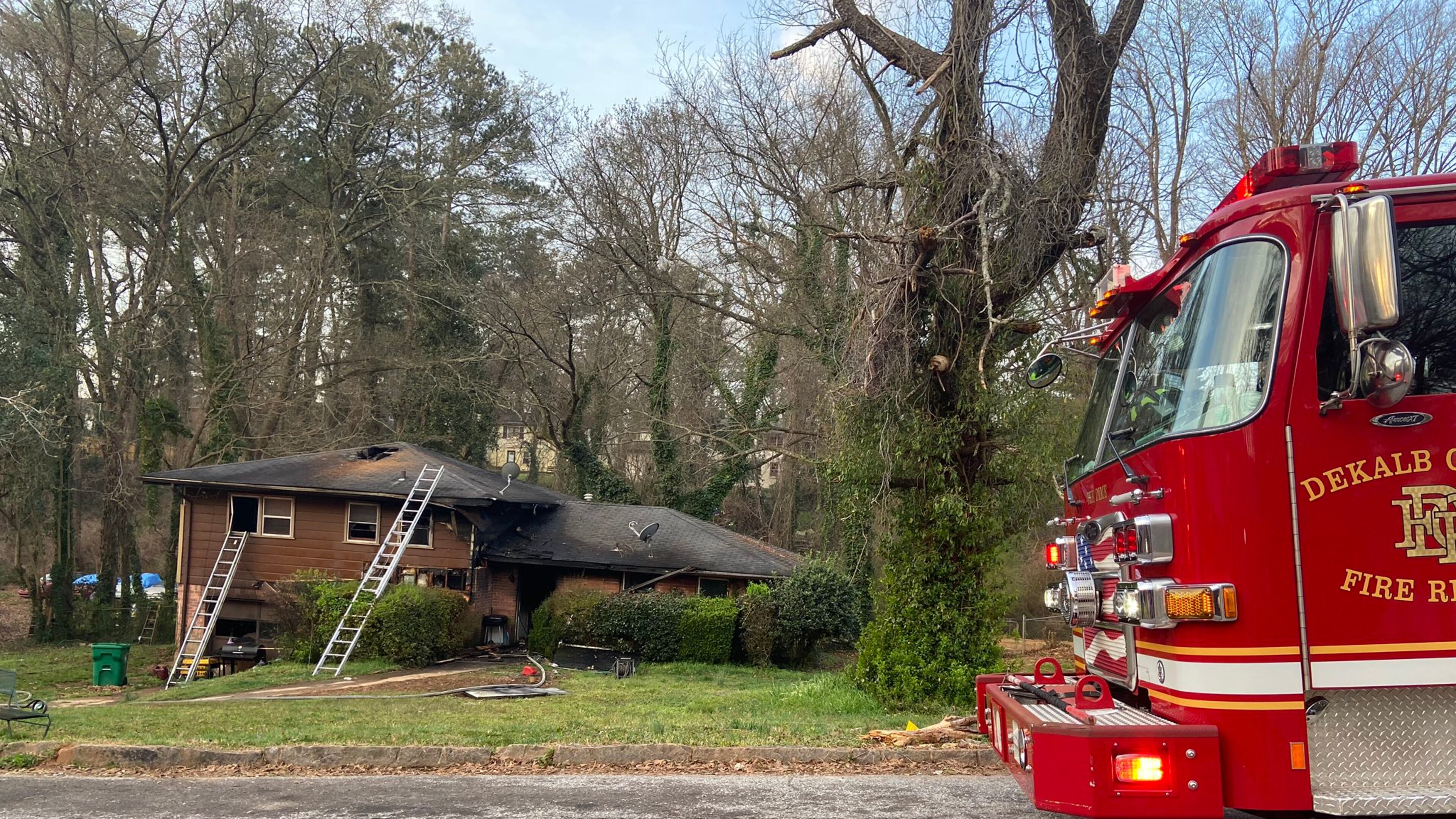 A woman is in critical condition after being pulled from a burning DeKalb County home Friday morning, officials said.