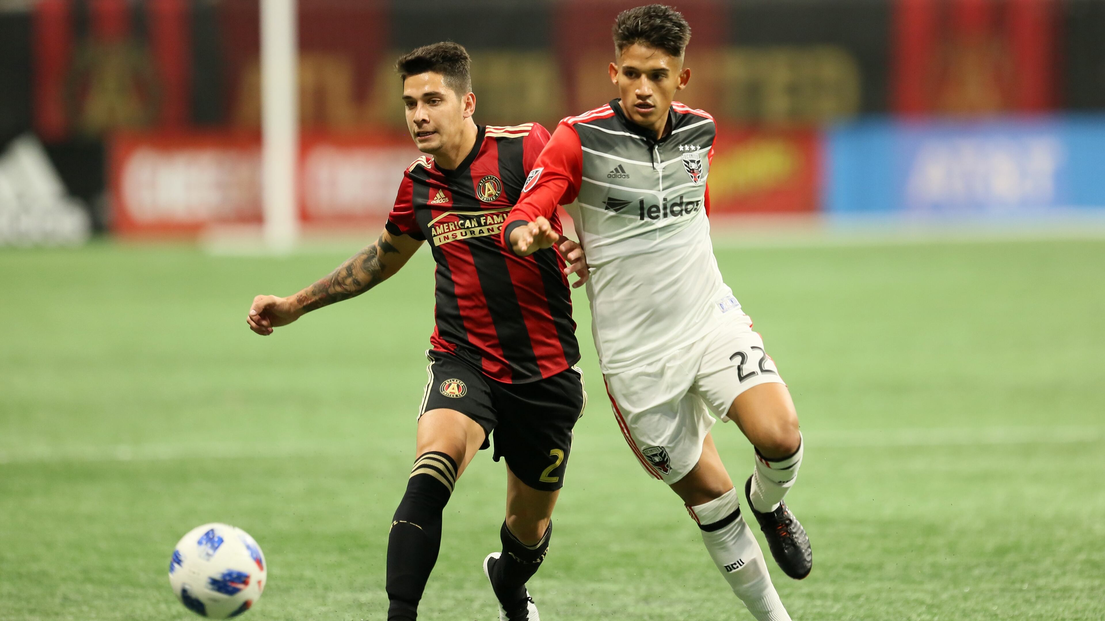 Atlanta United defender Franco Escobar competes with former teammate and D.C. United player Yamil Asad on March 11, 2018 in Atlanta Ga..