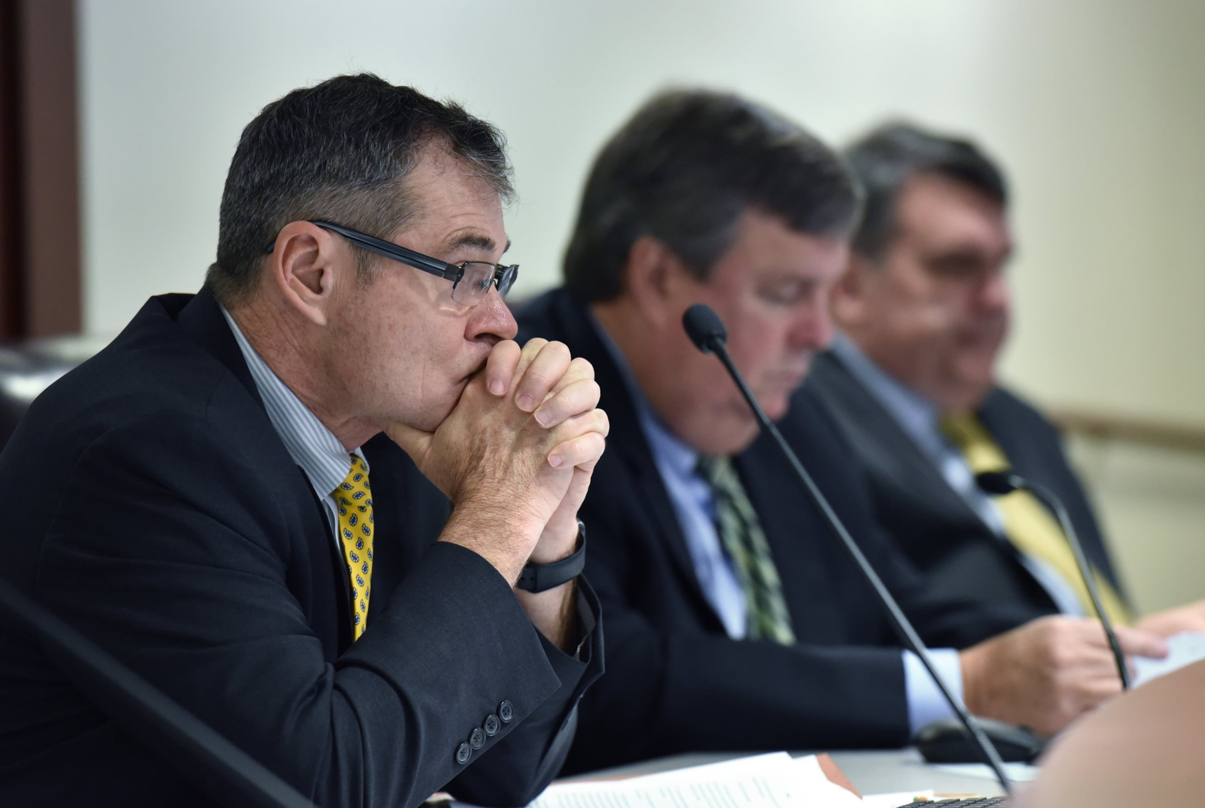 Commissioner Tim Echols (left) listens during a Georgia Public Service Commission meeting in December 2017. (Hyosub Shin/AJC)