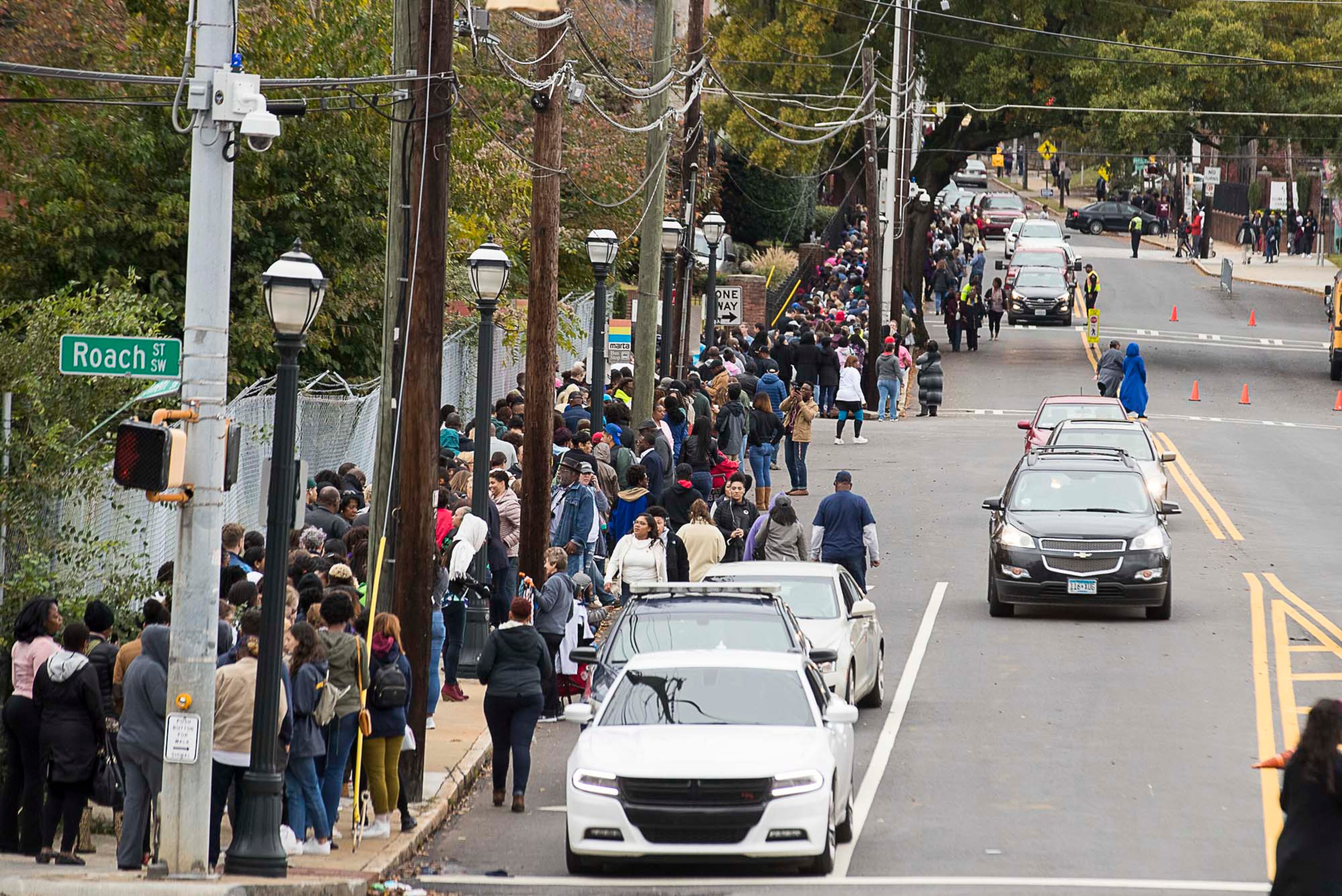 11/02/2018 -- Atlanta, Georgia -- People form a long line along Atlanta Student Movement Boulevard in order to see former President Barack Obama speak during a rally for gubernatorial candidate Stacey Abrams in Forbes Arena at Morehouse College, Friday, November 2, 2018. (ALYSSA POINTER/ALYSSA.POINTER@AJC.COM)