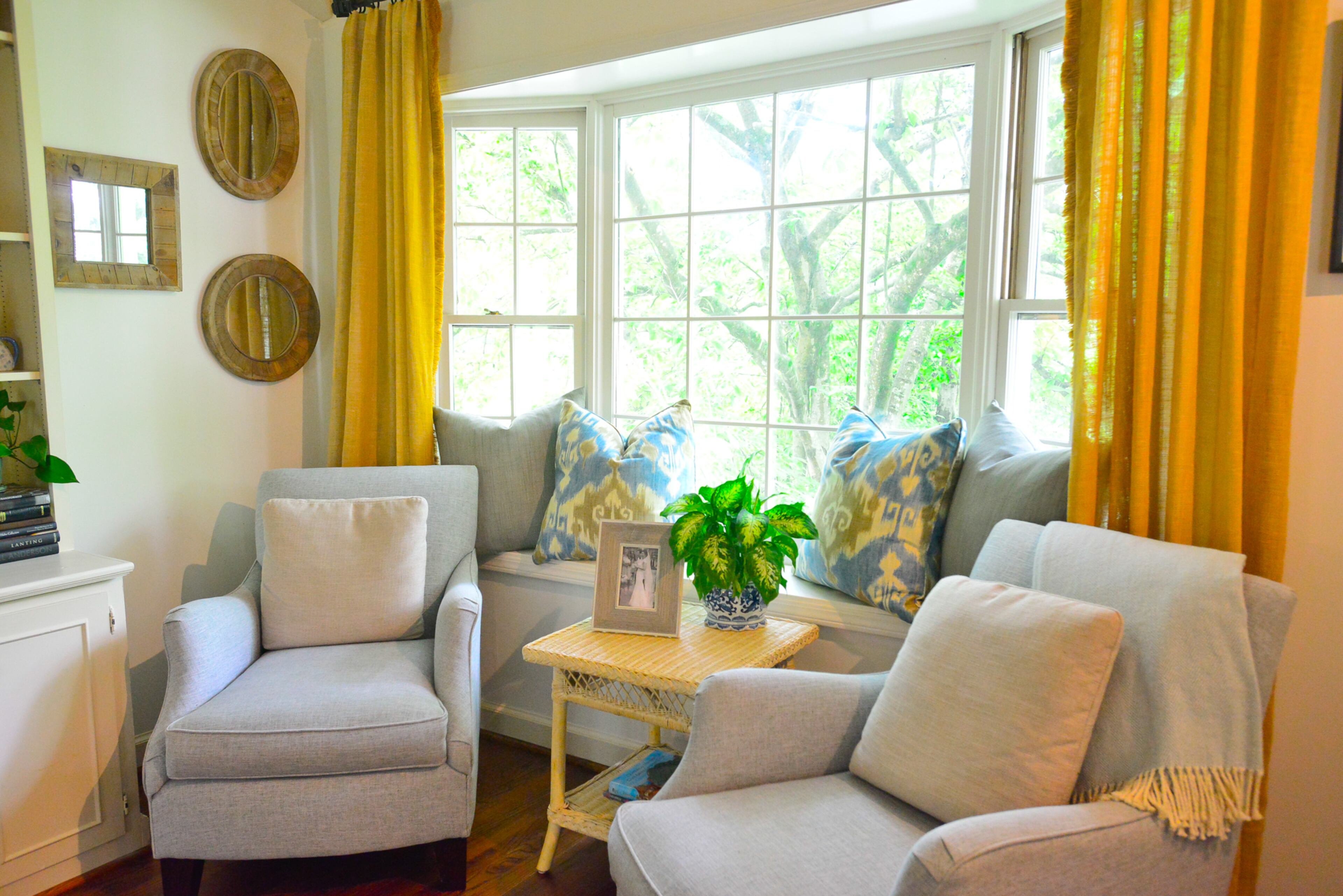 From the bay window, softened by custom-made draperies, the views of greenery and natural light flood into the family room. The chairs were custom ordered from Havertys, and the room also has bamboo side tables from an antique dealer in Sarasota, Fla., and throw pillows from Erika Reade.