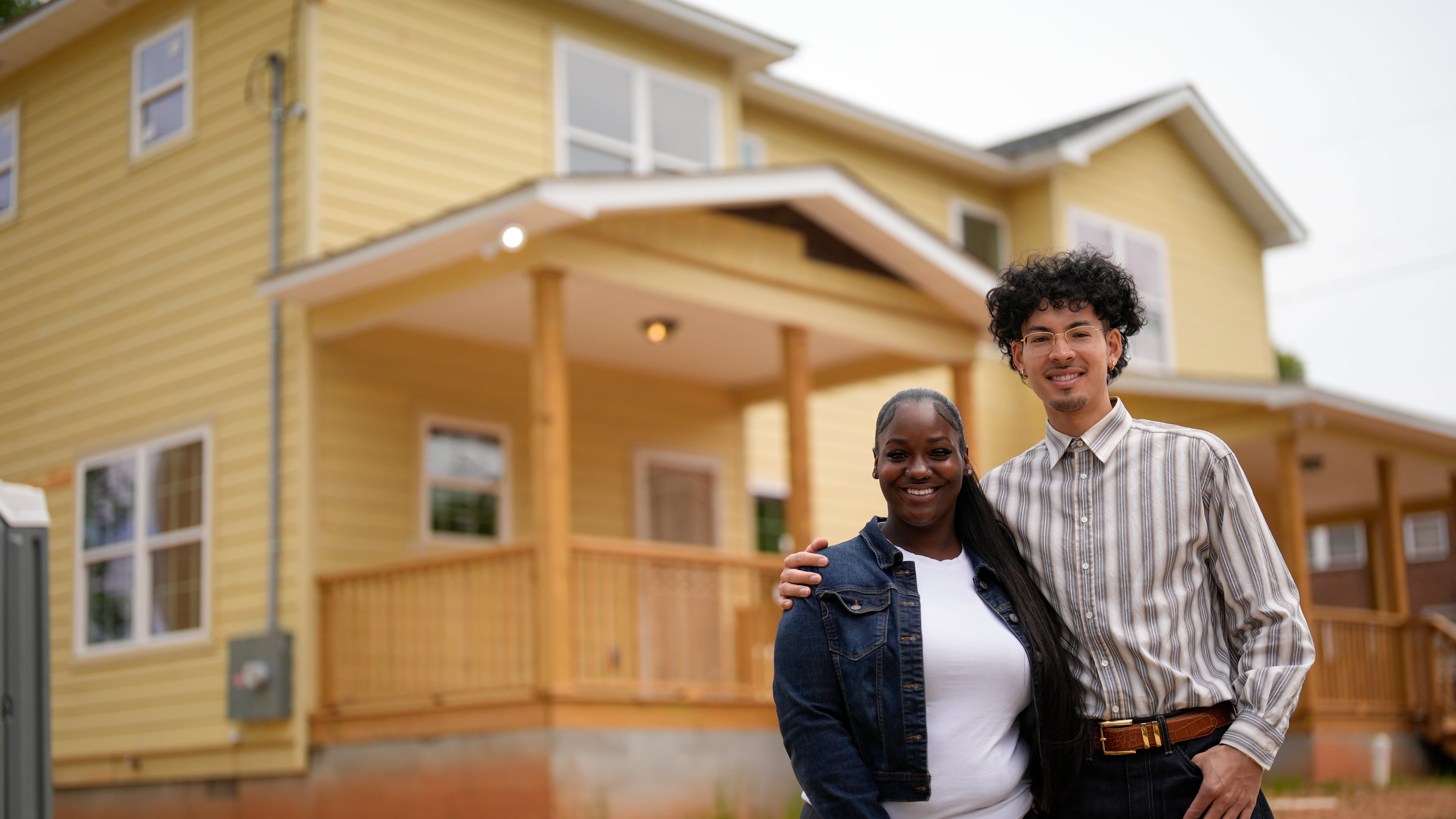 Home owners Phileena Daniel and Oswaldo Herrera pose for a photo in Langston Park, April 13, 2026, in Atlanta. (AP Photo/Mike Stewart)