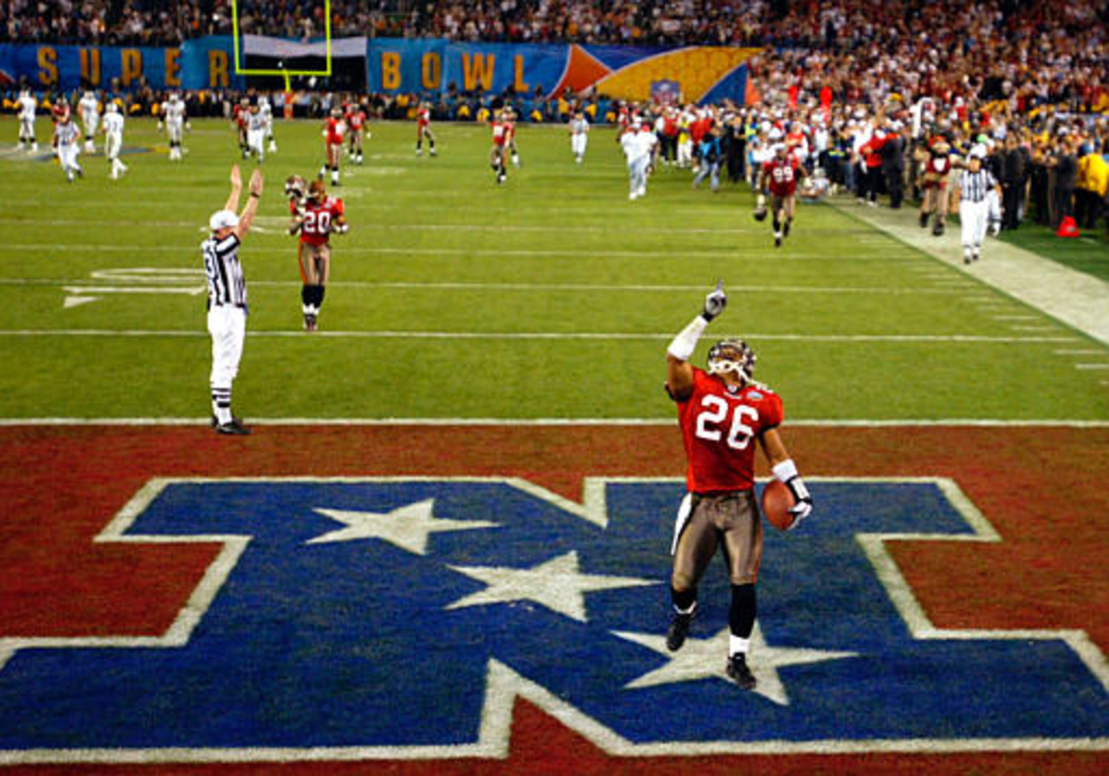 Tampa Bay Buccaneers cornerback Dwight Smith (26) celebrates his 50-yard interception return for a touchdown to cap the Buccaneers' 48-21 win over the Oakland Raiders in Super Bowl XXXVII in San Diego in this Jan. 26, 2003 photo. (AP Photo/Lawrence Jackson)