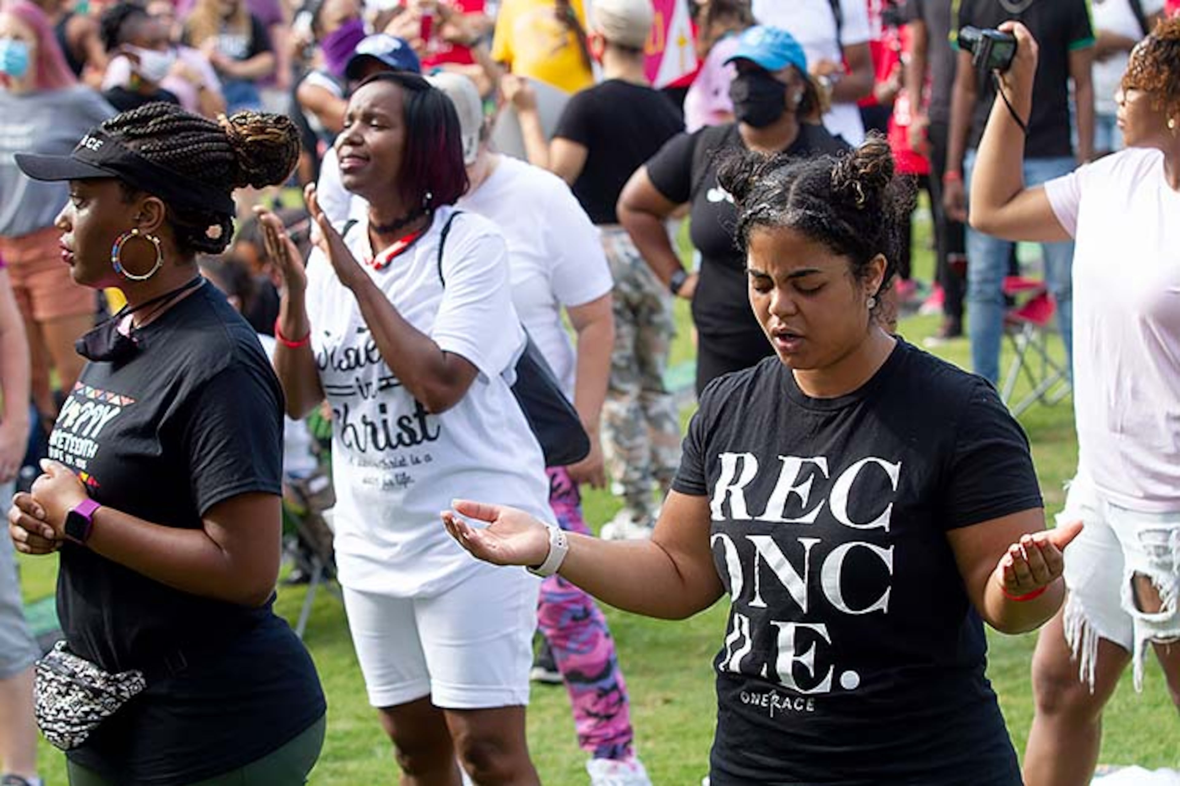 A large crowd gathers at the Centennial Olympic Park stage for an OneRace prayer and worship before marching to the State capital Friday, June 19, 2020. STEVE SCHAEFER FOR THE ATLANTA JOURNAL-CONSTITUTION
