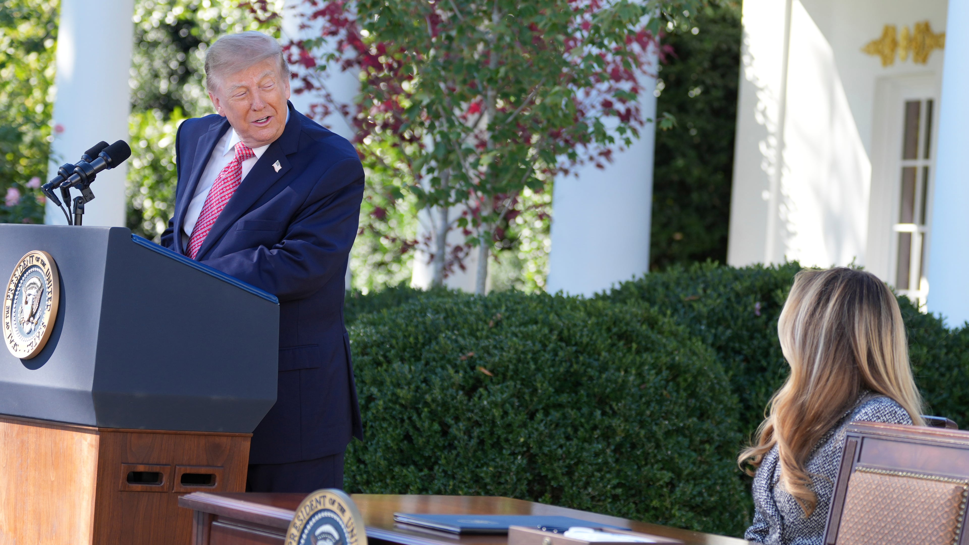 President Donald Trump looks to first lady Melania Trump as he speaks during an event about women's health, in the Rose Garden of the White House, Monday, Oct. 19, 2026, in Washington. (AP Photo/Alex Brandon)