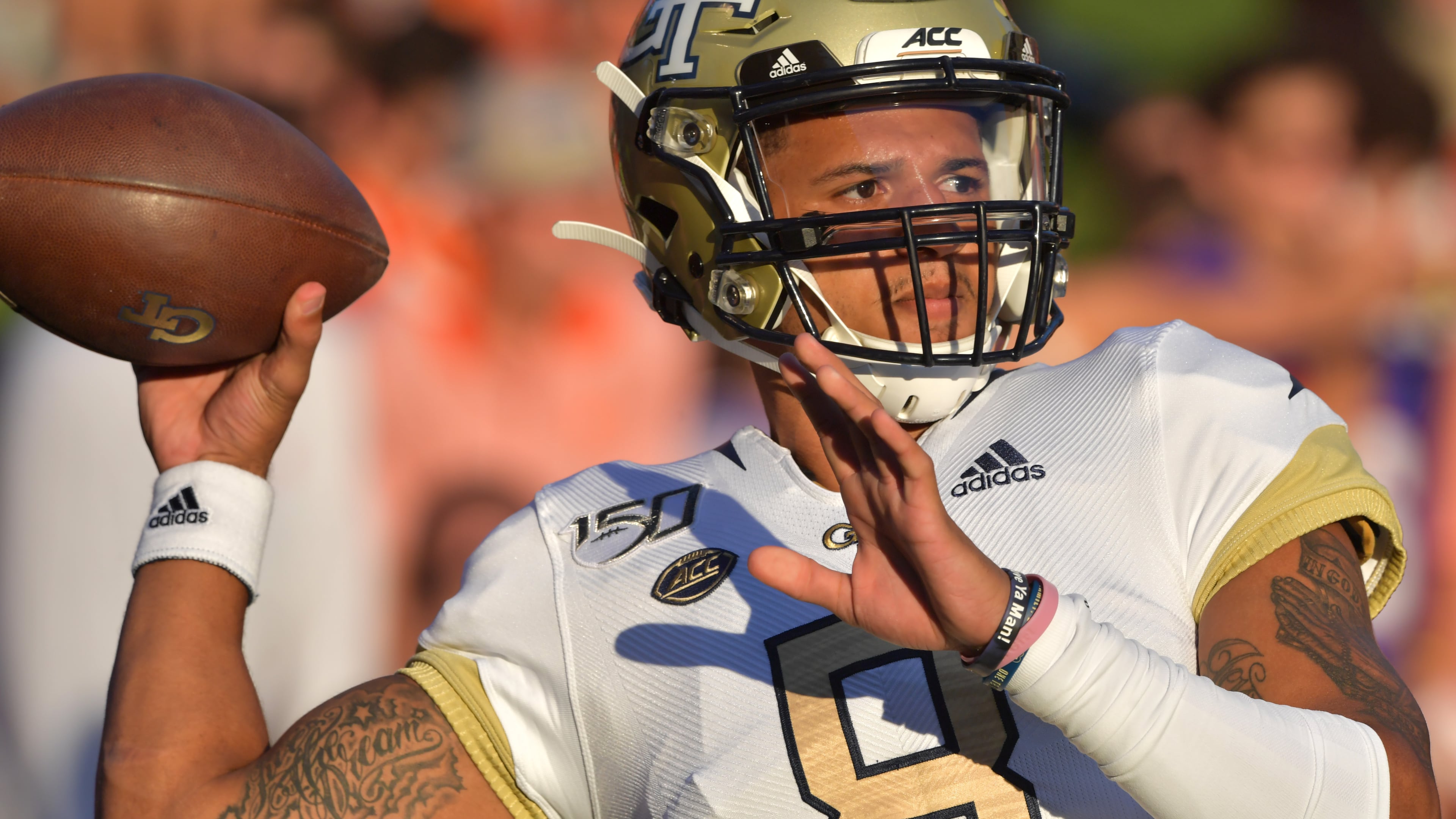 Georgia Tech quarterback Tobias Oliver (8) warms up before their game against the Clemson at Memorial Stadium on the Clemson University campus in Clemson, S.C. on Thursday, August 29, 2019. Georgia Tech took the field for the first time with Geoff Collins as head coach. (Hyosub Shin / Hyosub.Shin@ajc.com)