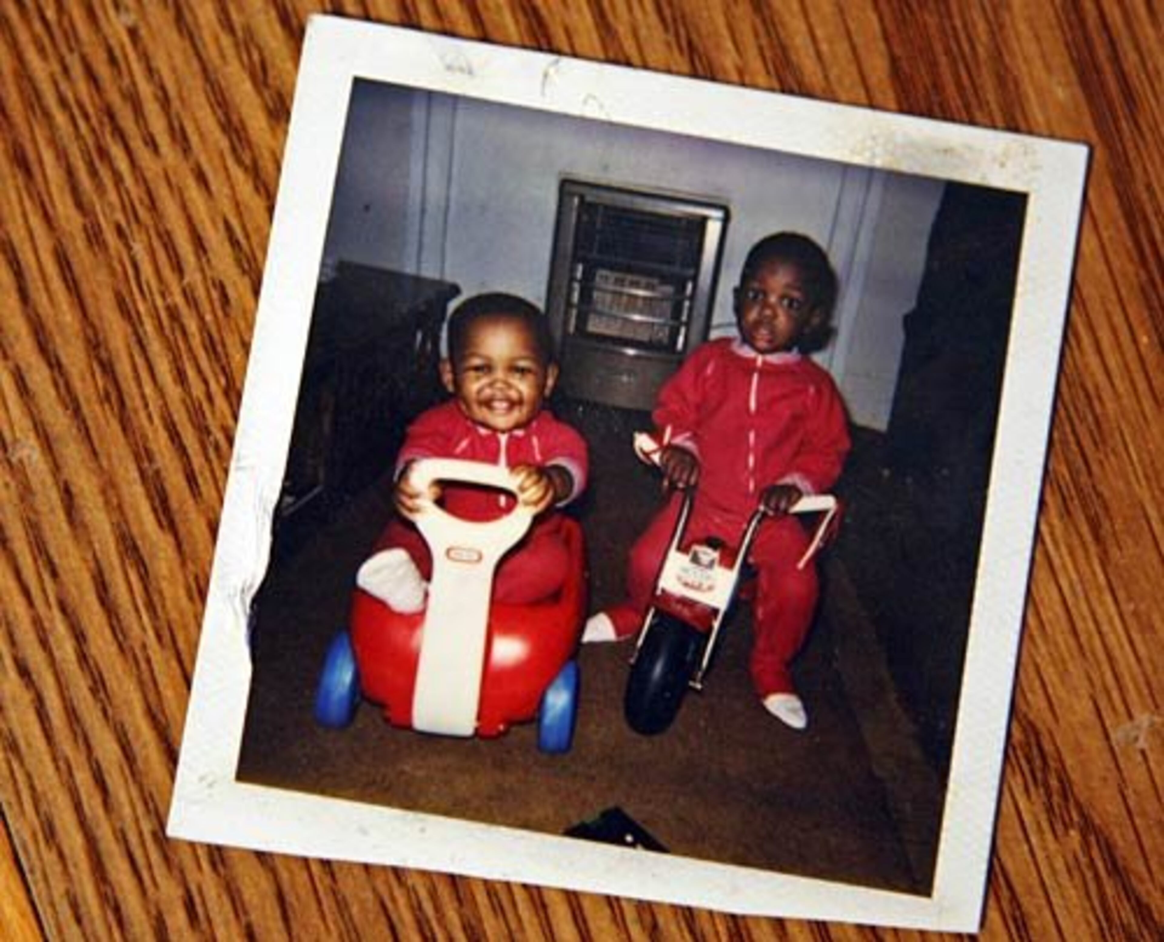 A family photo shows the Ogletree twins, Alexander "Zander" (left) and Alec (right) when they were babies around one-year-old. "Even at a young age you could tell which Ogletree was which," AJC photographer Jason Getz, who followed the Newnan High football standouts over the 2009 season through 2010 Signing Day, says. Following are Getz's comments on the photo project.