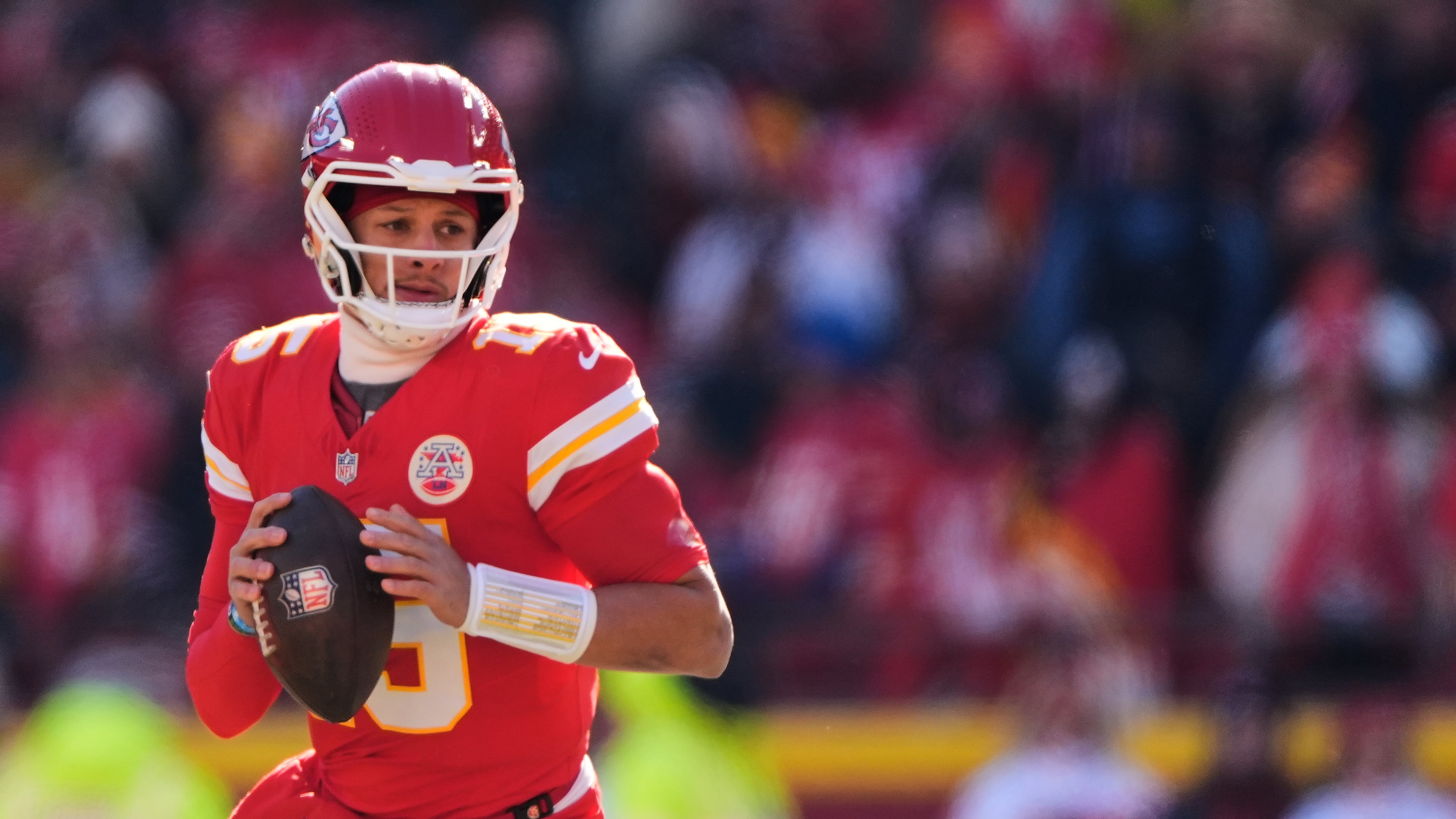 FILE - Kansas City Chiefs quarterback Patrick Mahomes looks to pass during the first half of an NFL football game against the Los Angeles Chargers, Dec. 14, 2025, in Kansas City, Mo. (AP Photo/Charlie Riedel, File)
