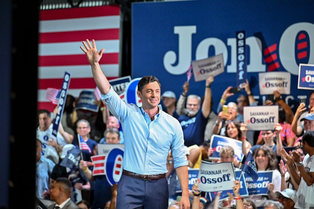 U.S. Sen. Jon Ossoff waves to the crowd at a rally in Savannah in June. (Sarah Peacock for the AJC)