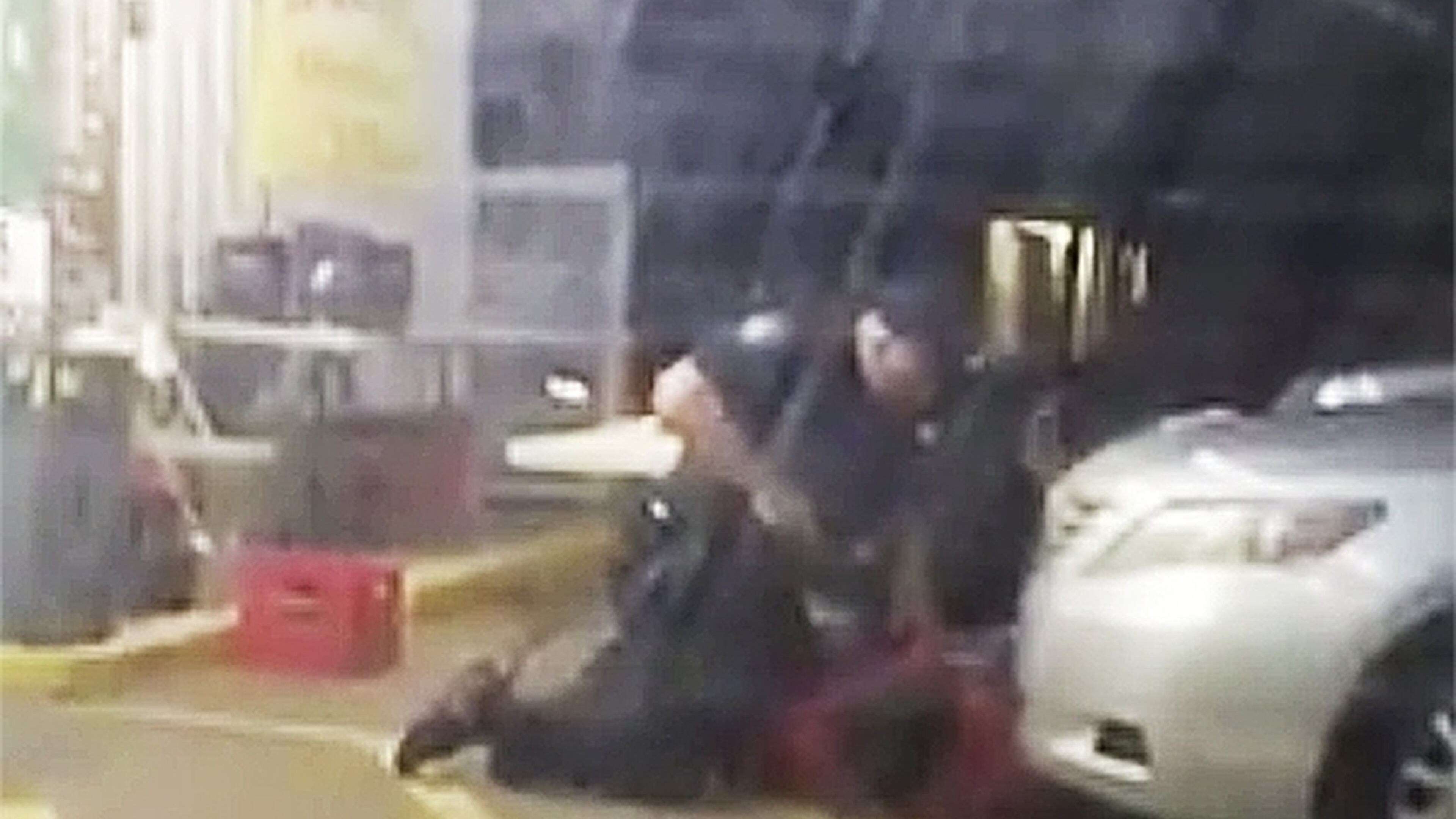 In this image made from video, taken July 5, 2016, Alton Sterling is held by two Baton Rouge police officers, with one holding a hand gun, outside a convenience store in Baton Rouge, La. Moments later, one of the officers shot and killed Sterling, a black man who had been selling CDs outside the store, while he was on the ground. (Arthur Reed via AP)